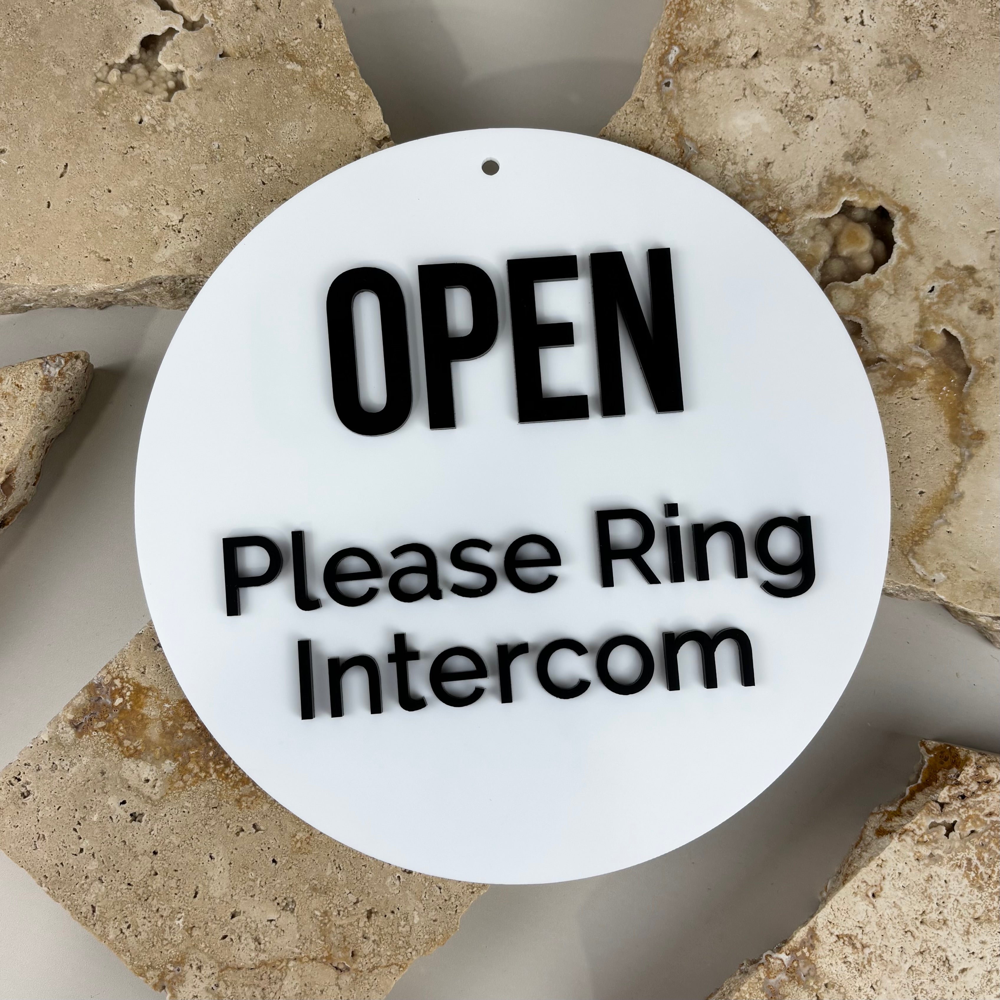 Double sided round acrylic open sign with raised black 3D lettering for salon and business doors