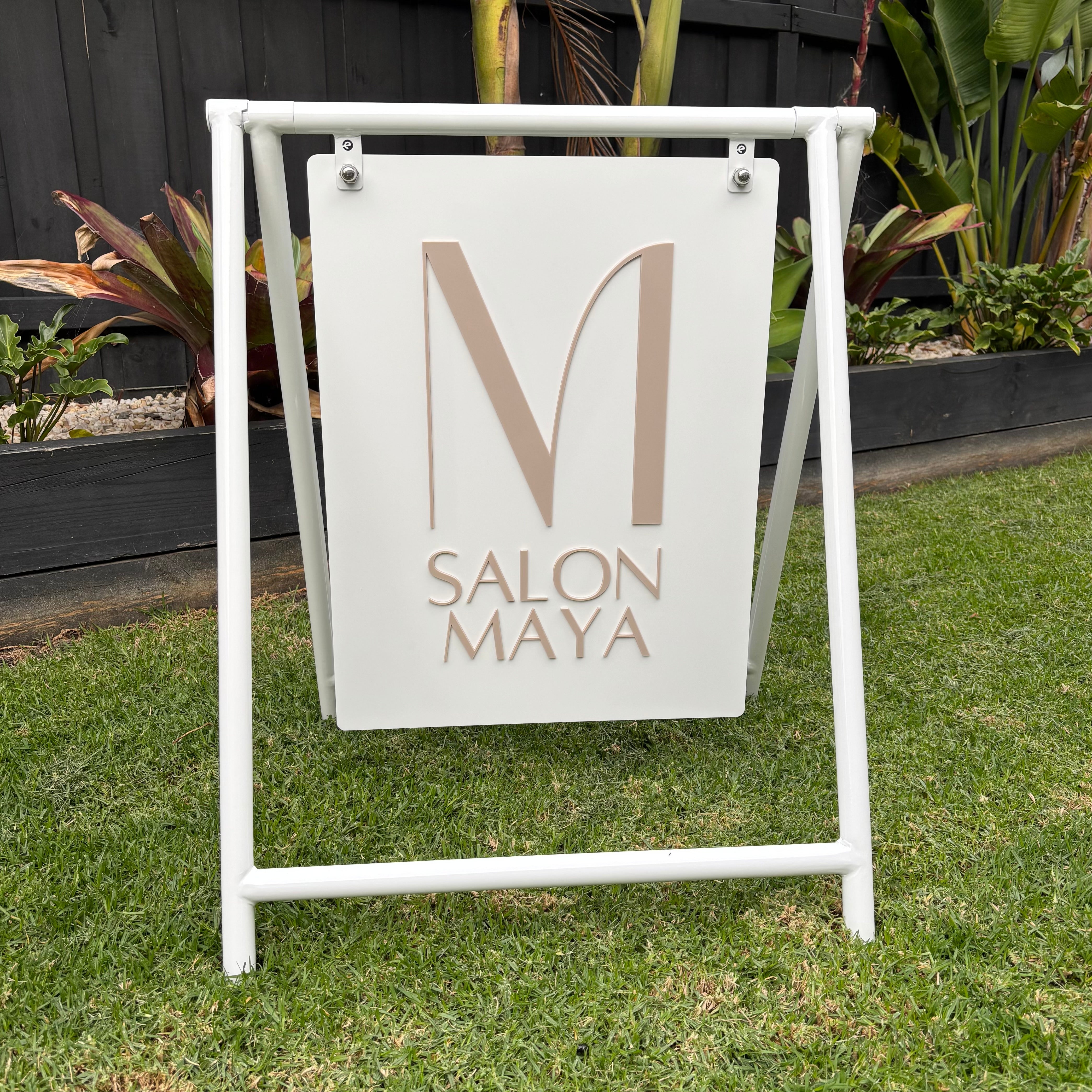 Custom white Swing A Frame sign with raised acrylic logo for salon storefront branding and outdoor business advertising