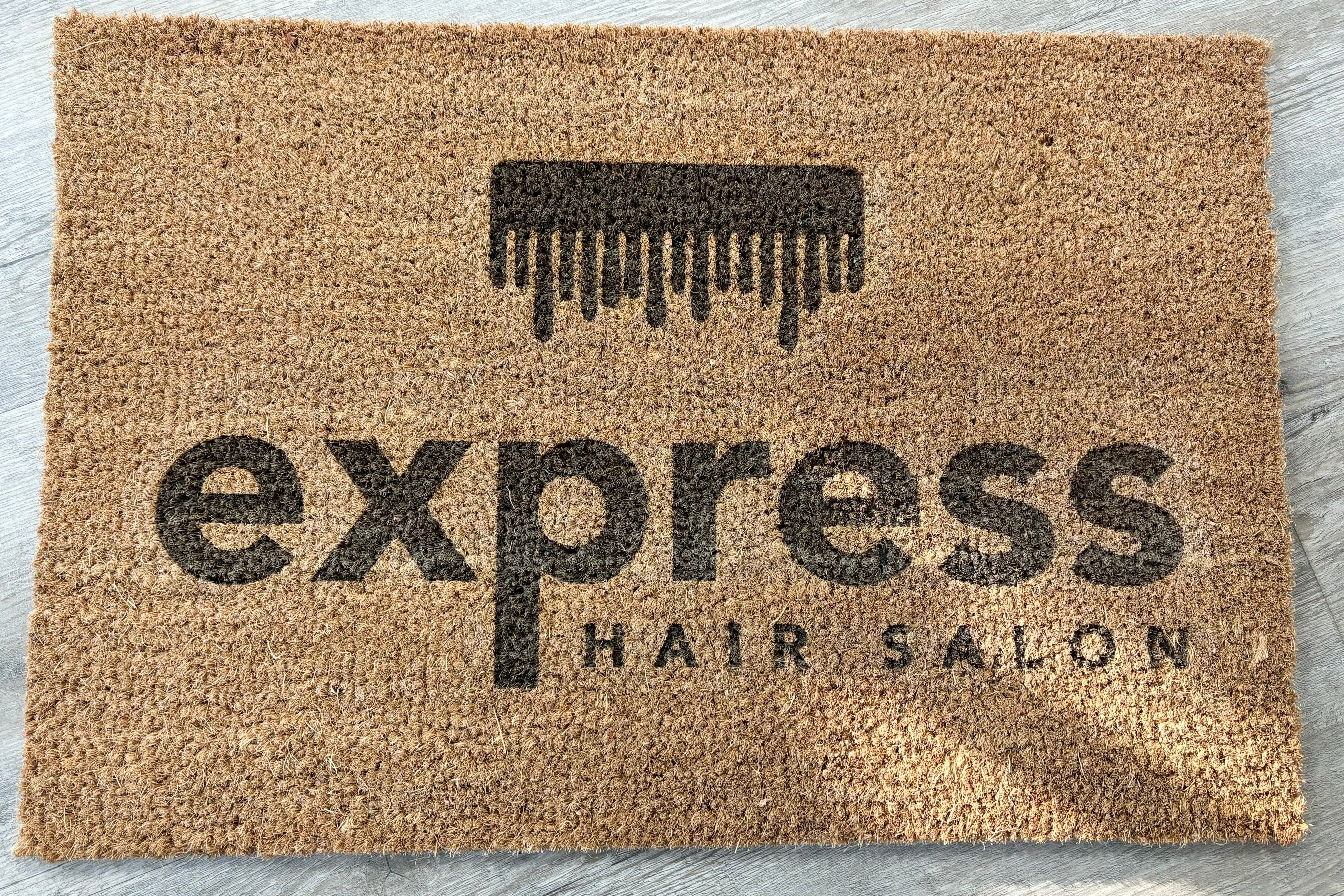Hair salon logo printed on a custom entrance mat