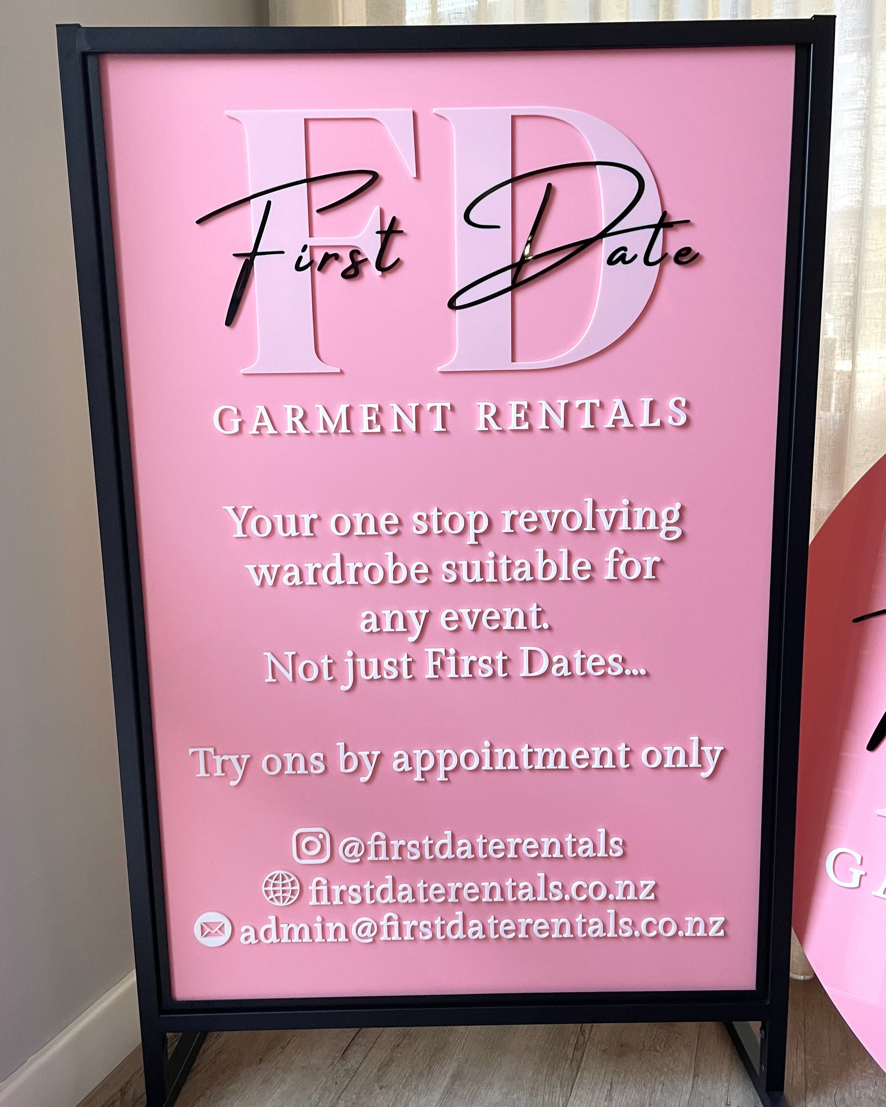 Black framed outdoor T frame sign with detailed salon menu