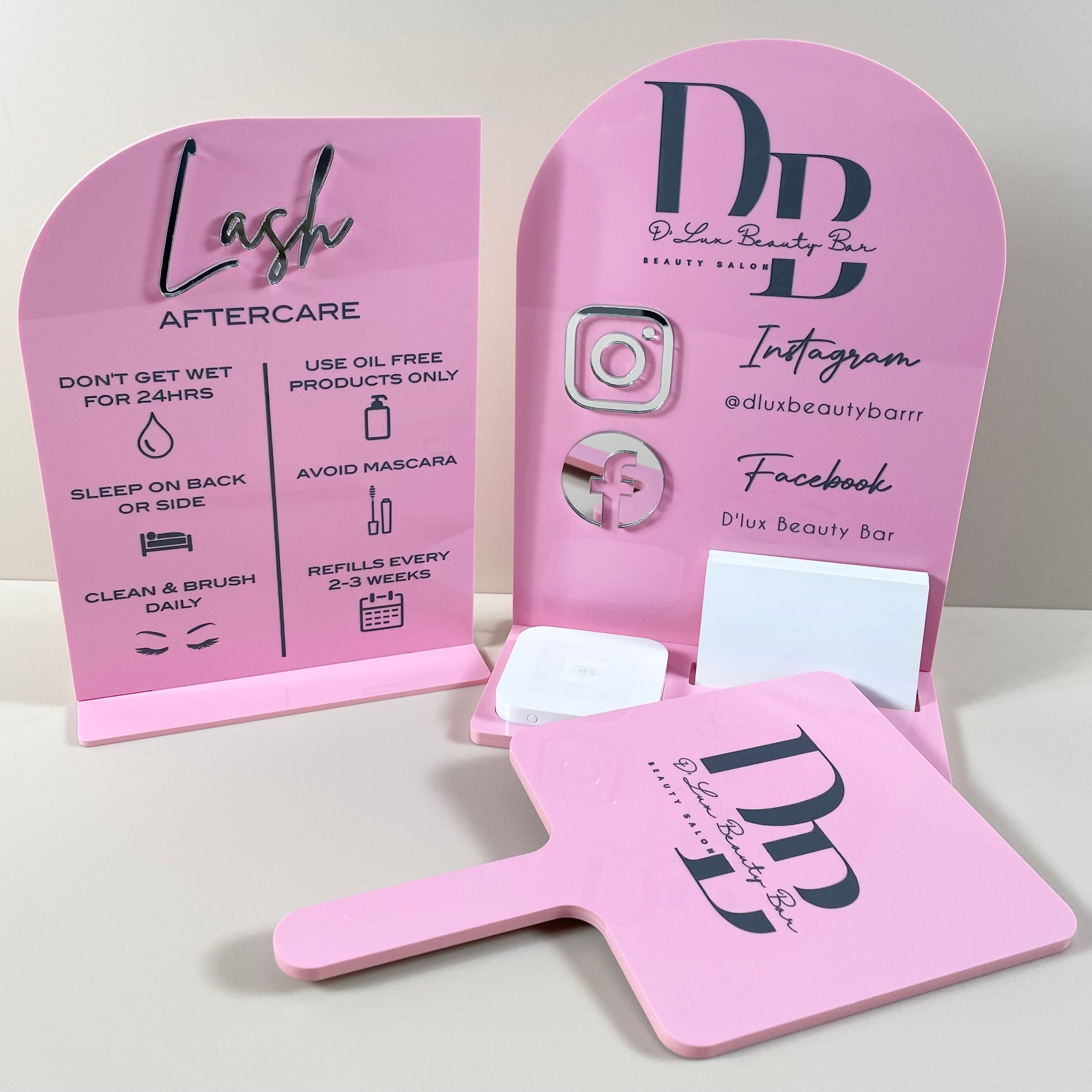 Pink and black acrylic signage set with mirror, QR code stands and branding for lash and brow salon