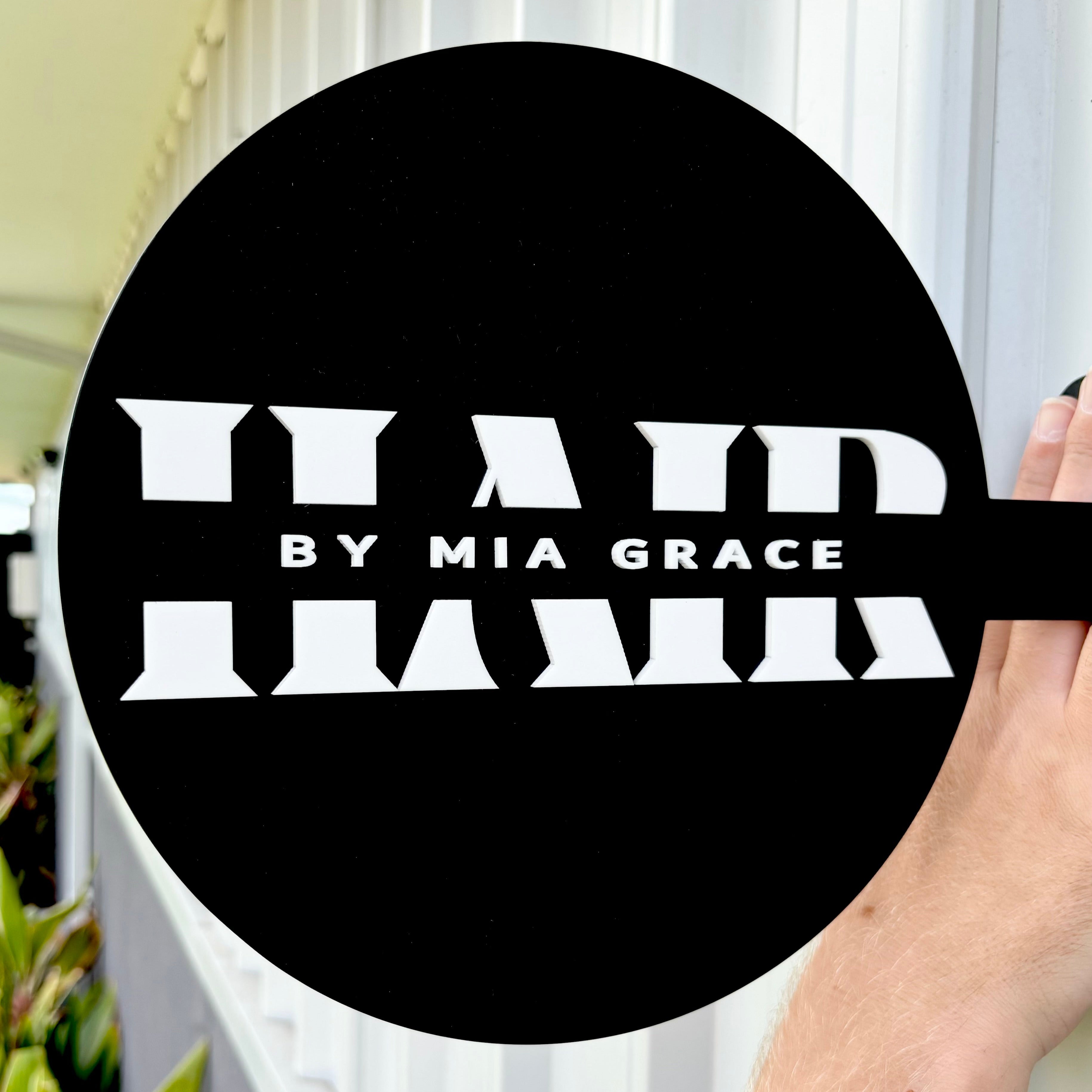 Black and white business round blade sign for Hair by Mia Grace