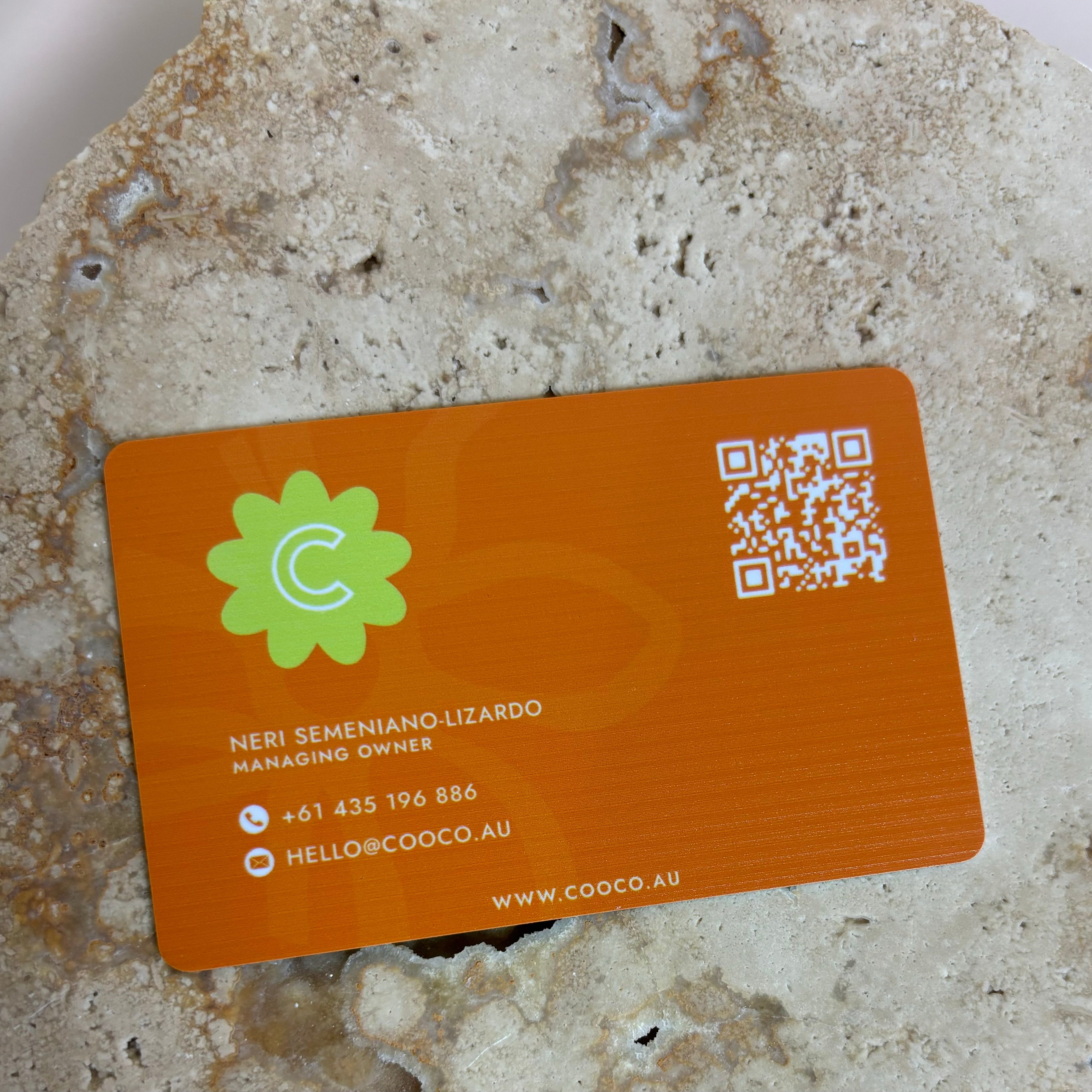 Orange NFC contactless card with custom branding and social icons