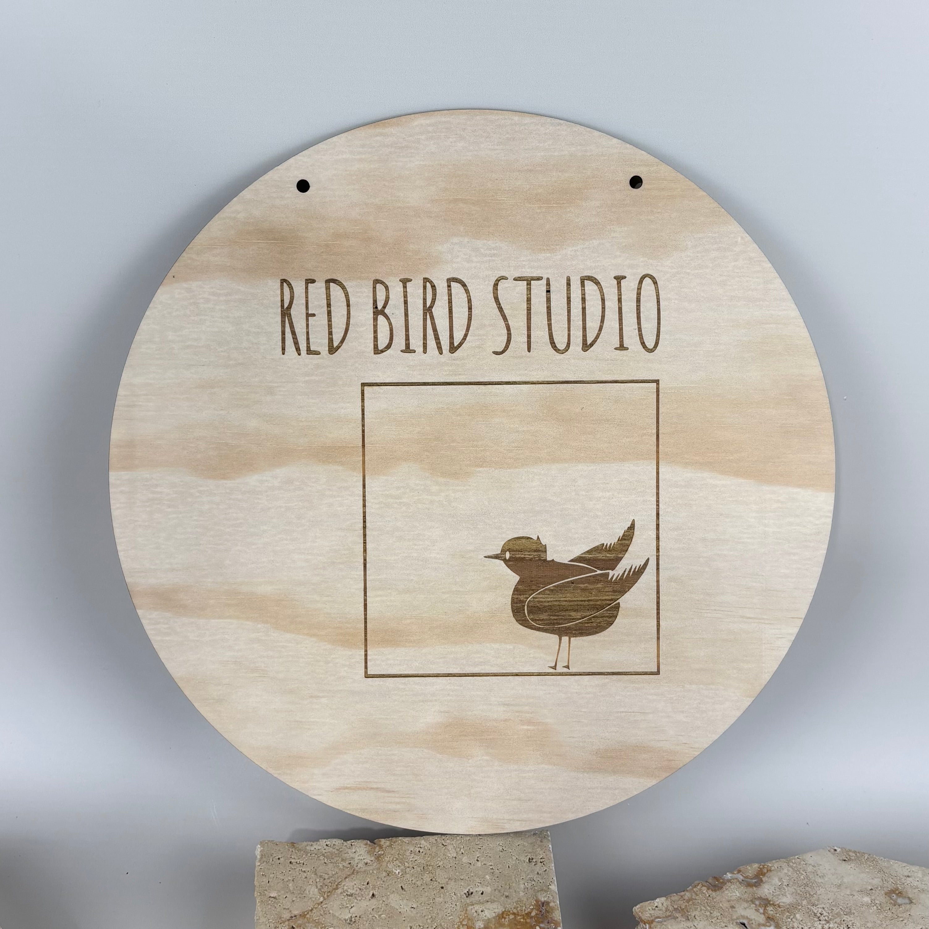 Custom engraved round timber business sign for studios, shops, or home offices.