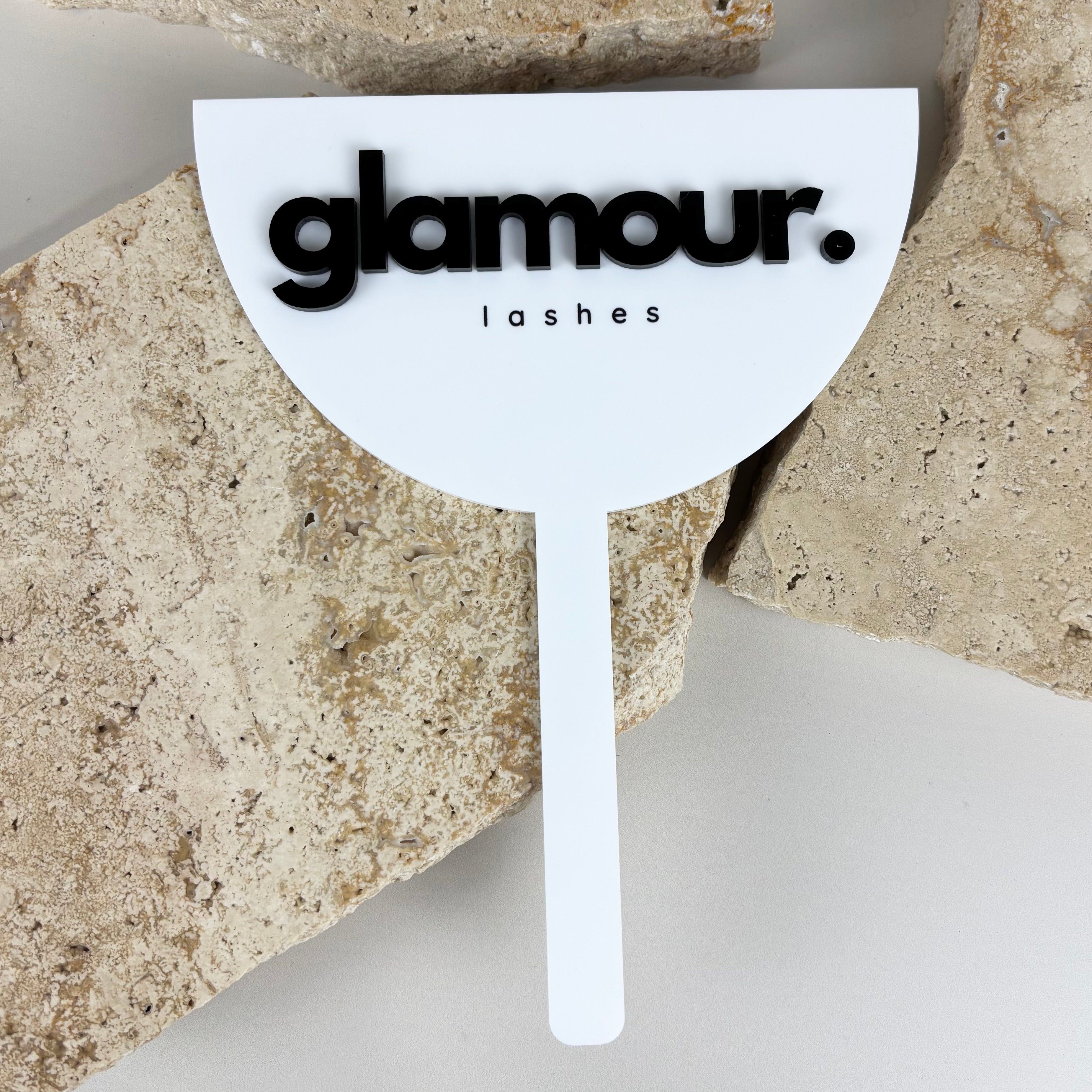 Custom white acrylic handheld mirror with Glamour Lashes logo in black for beauty salon branding