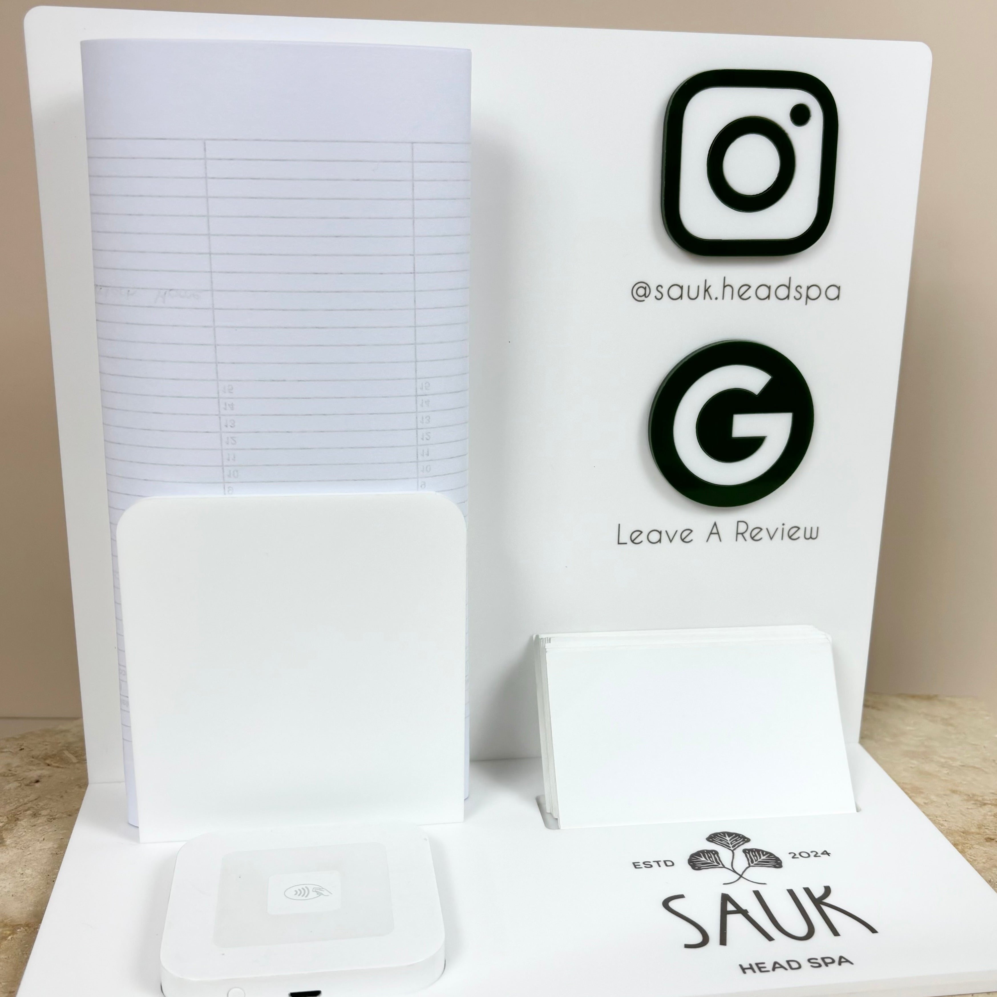 White custom reception counter stand with social icons and card reader holder