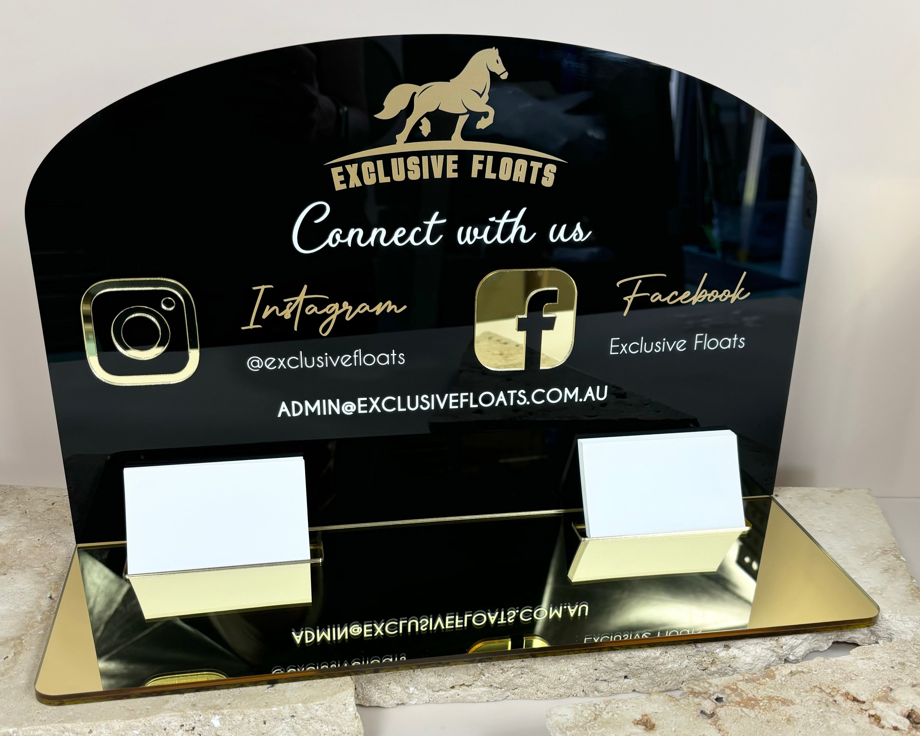 Black acrylic business station with gold branding, Square holder, and social media links