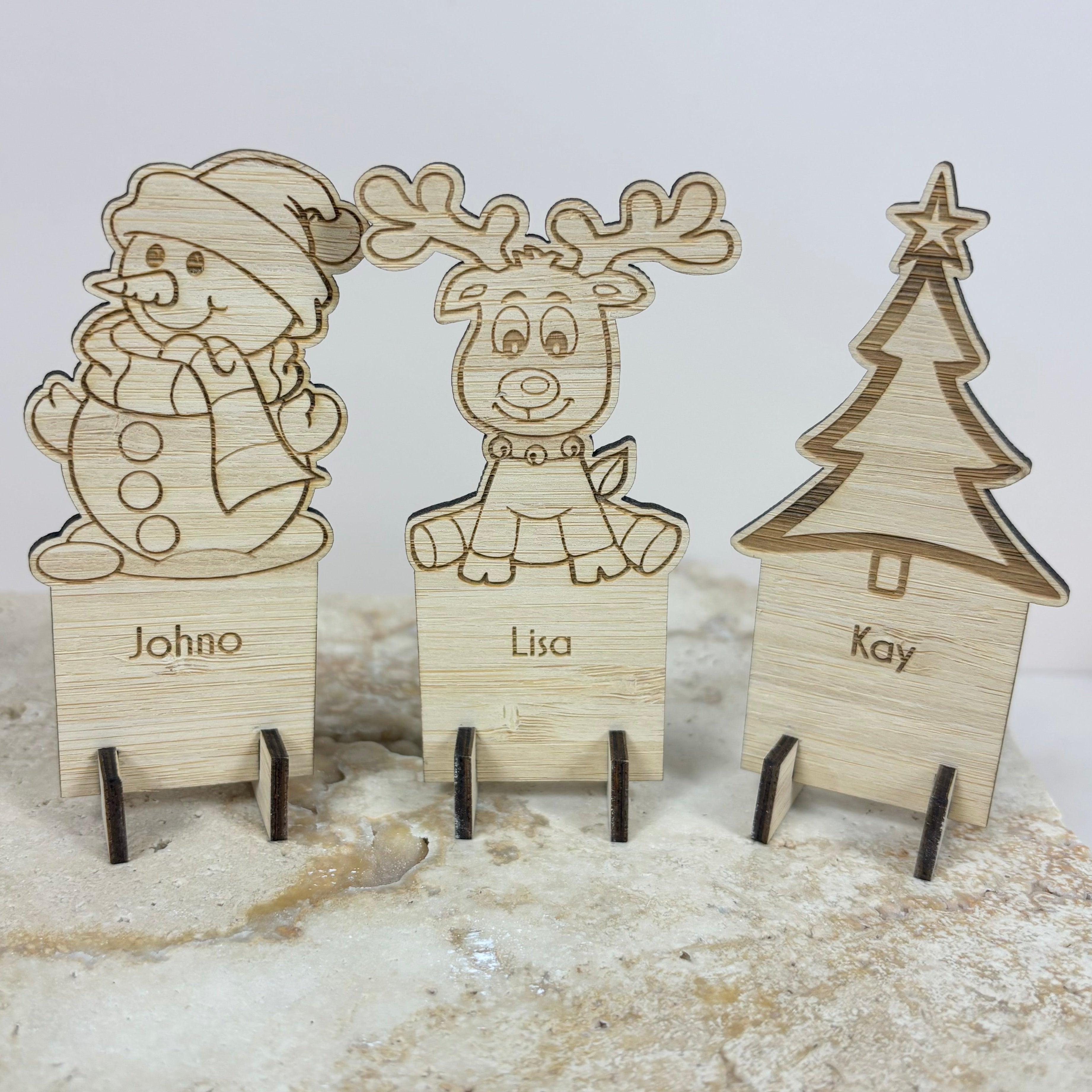 Custom engraved Christmas place cards featuring reindeer design with personalised guest names