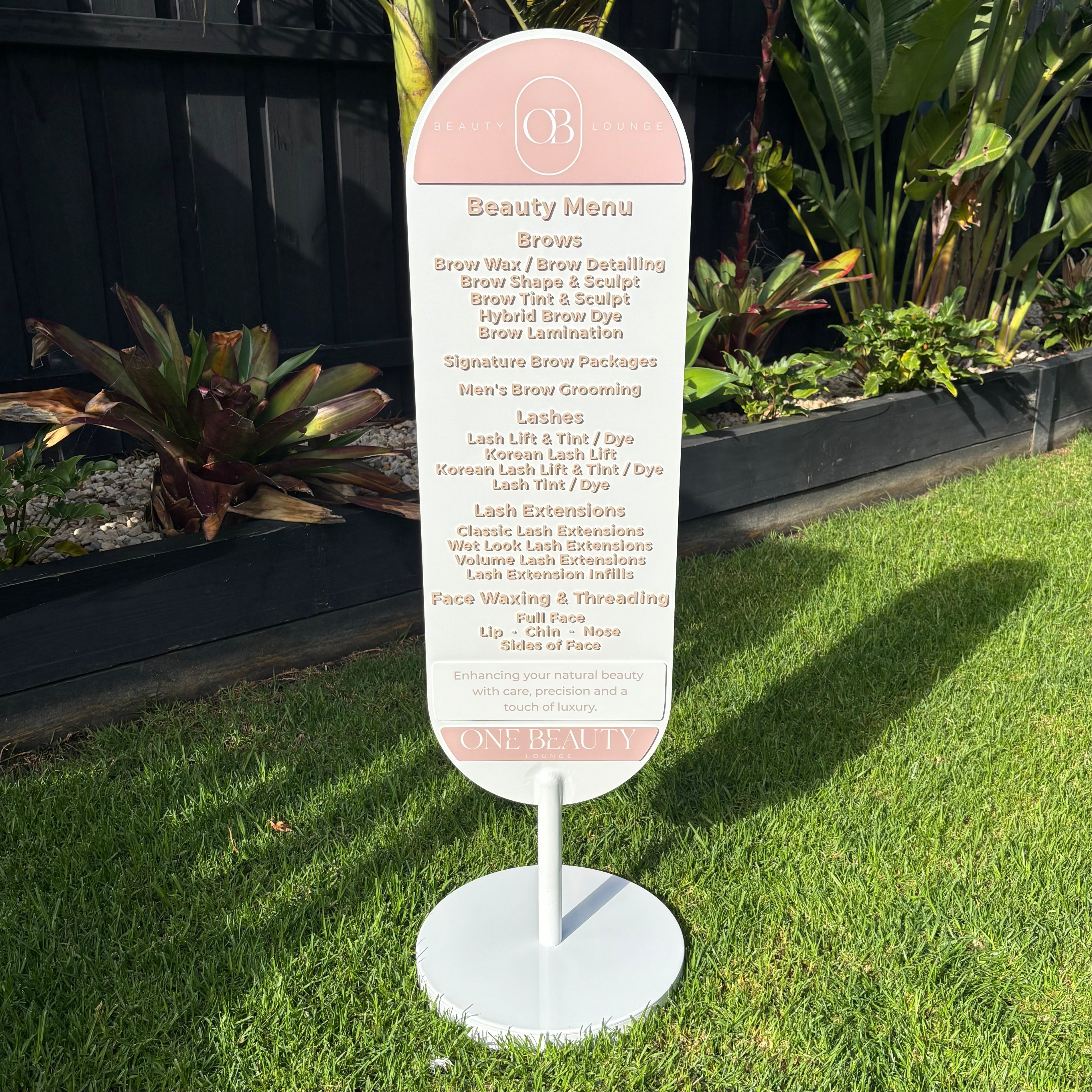 Double-sided beauty salon menu sign with 3D acrylic text displaying brow services, lash extensions, lash lifts and facial waxing treatments. Premium freestanding oval business sign and outdoor advertising display for beauty lounges, brow bars and lash studios.