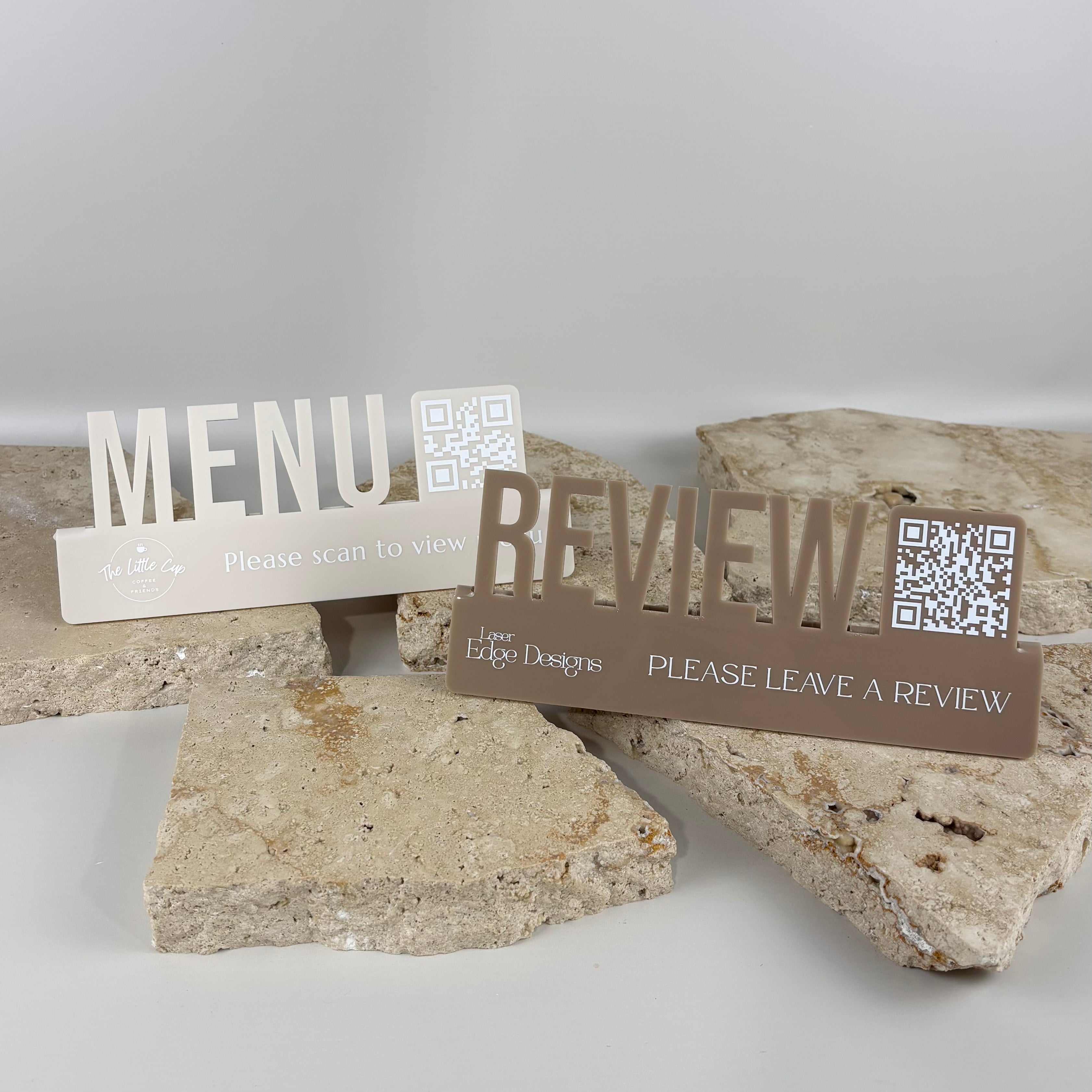 Custom QR code menu and review acrylic table signs on stone background