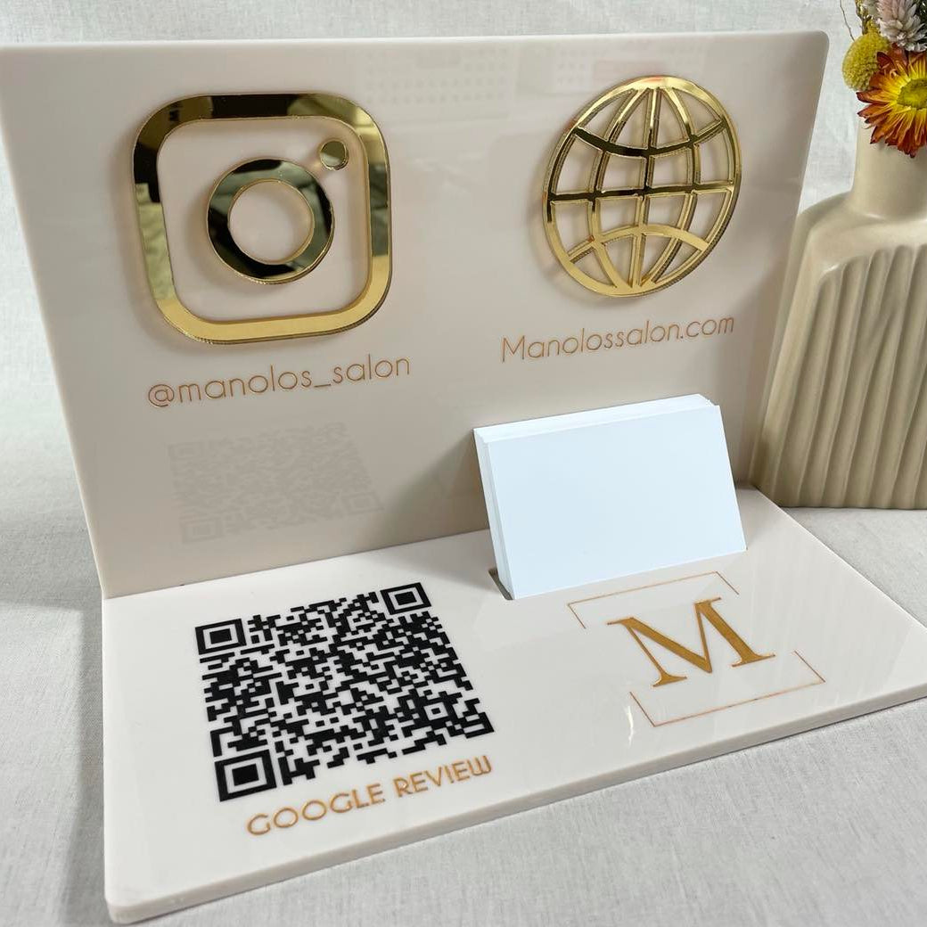 Beige and gold acrylic counter stand with globe icon and custom branding