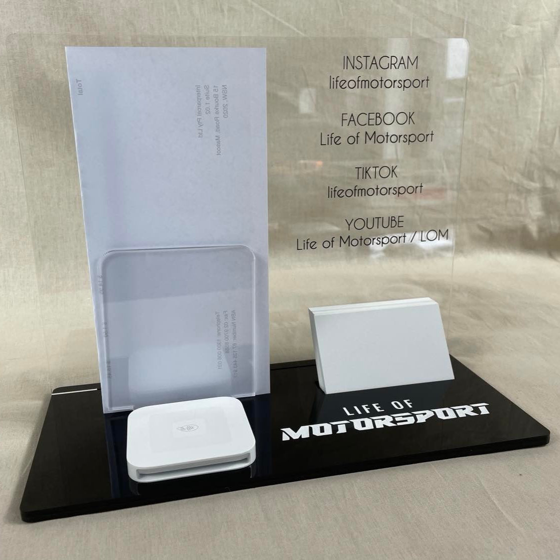 Black acrylic business stand with brochure holder and business card slot