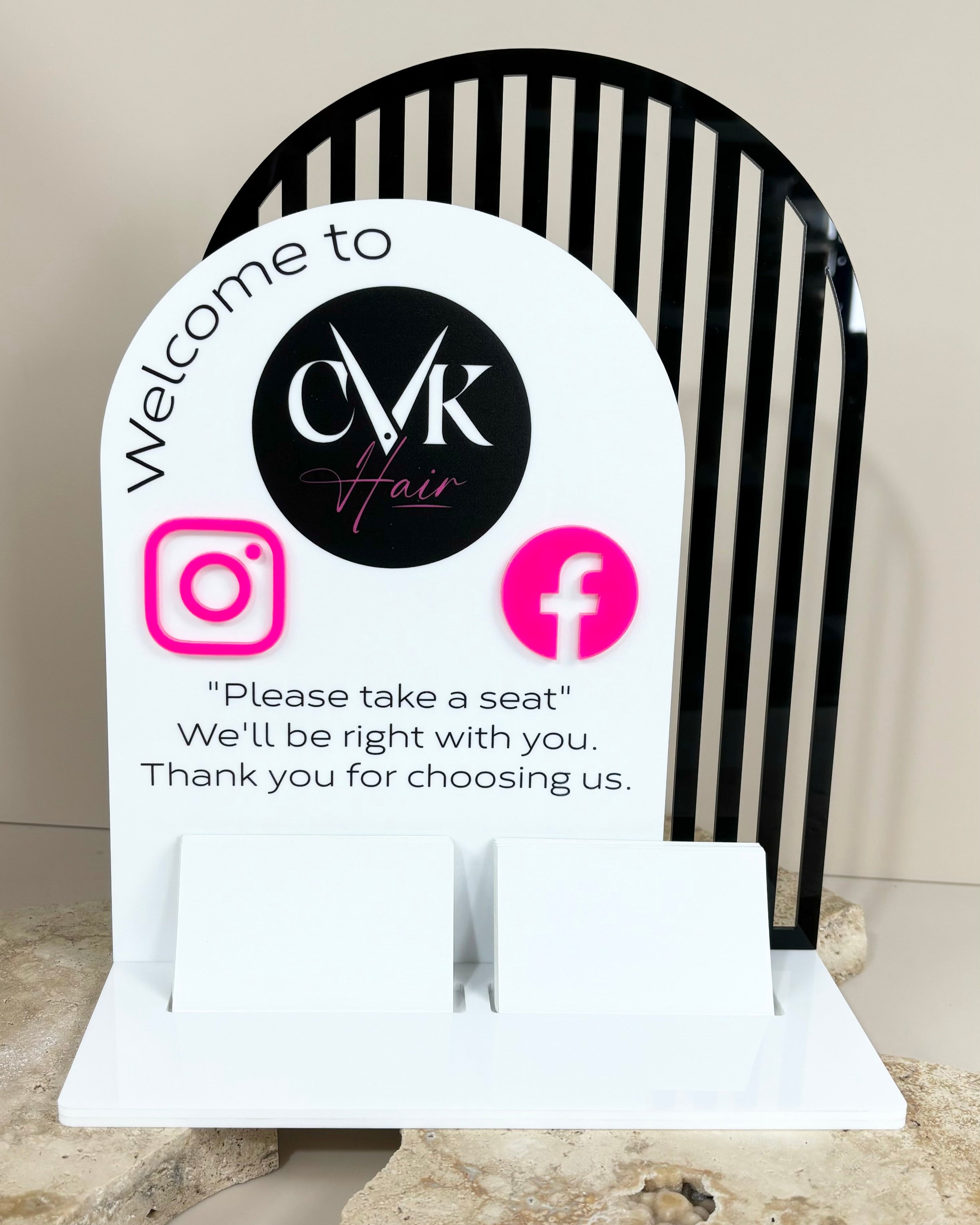 Black and white curved corner display stand with social media branding
