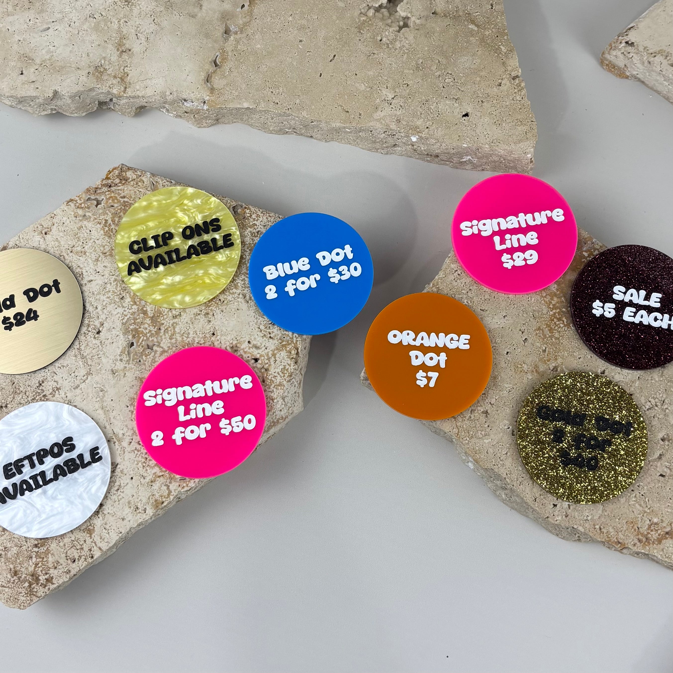 Custom acrylic price discs with personalised text, reusable retail price tags and product display signs for market stalls, boutiques, salons and small businesses.