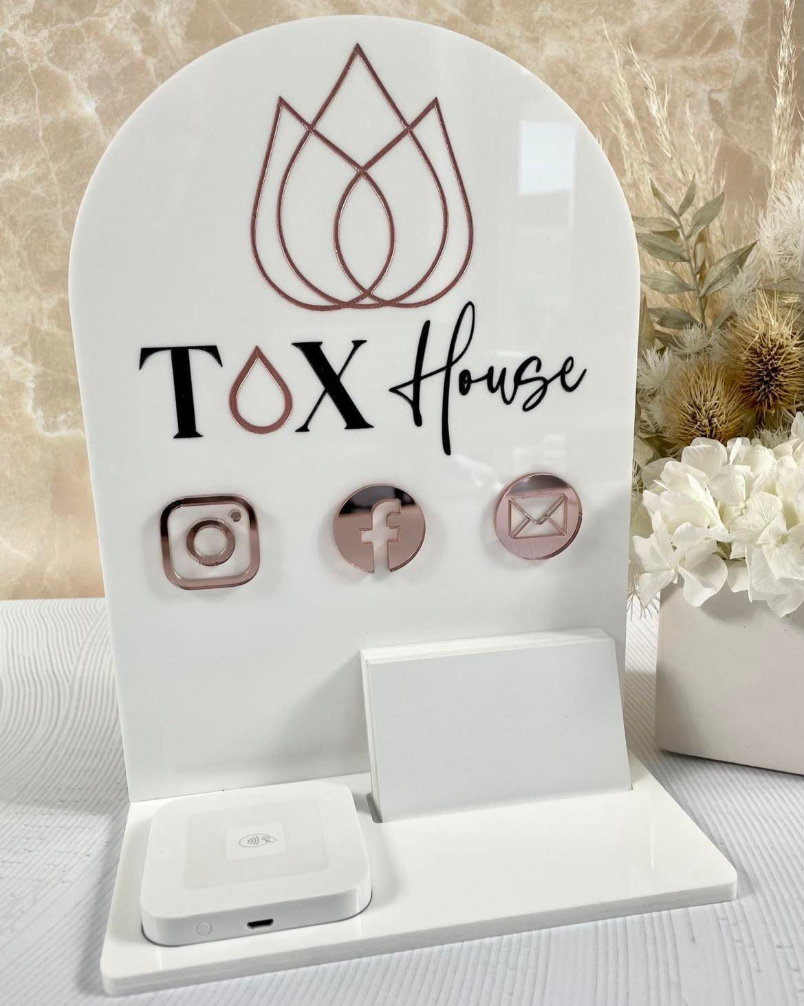 White acrylic social media display with QR codes and card holder