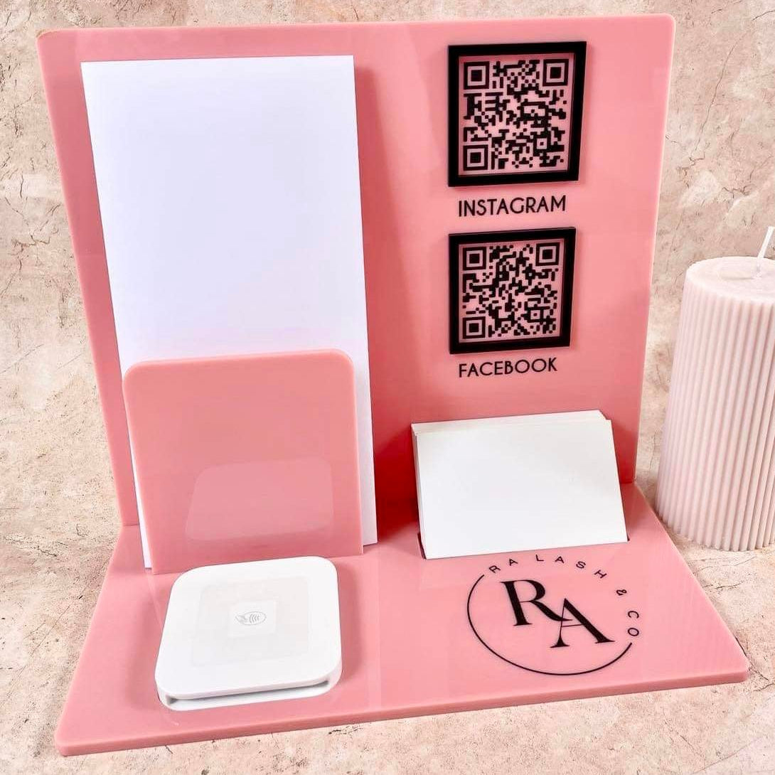 Pink business signage display with QR codes, brochure holder and Square payment holder
