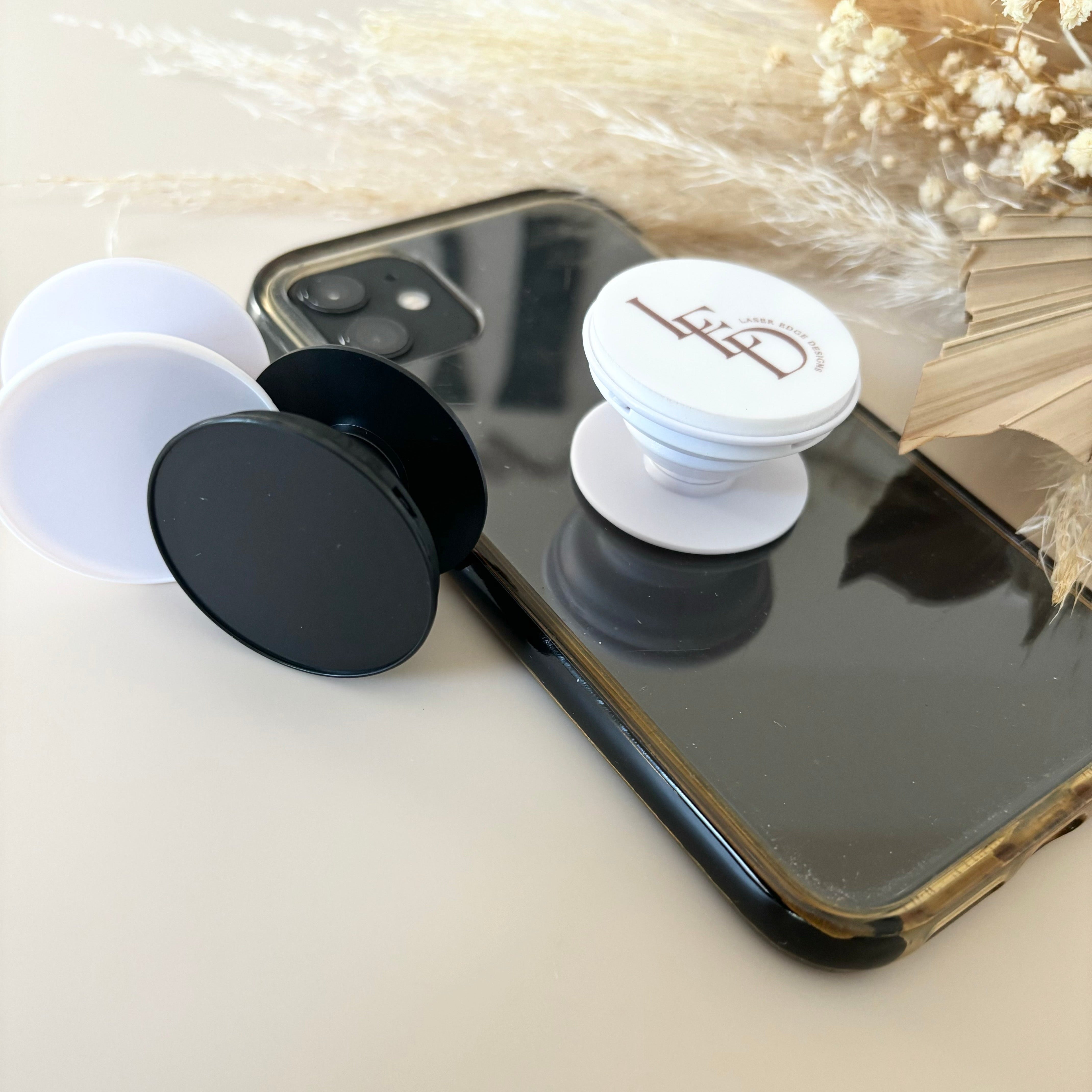Promotional phone grip with printed business logo in use