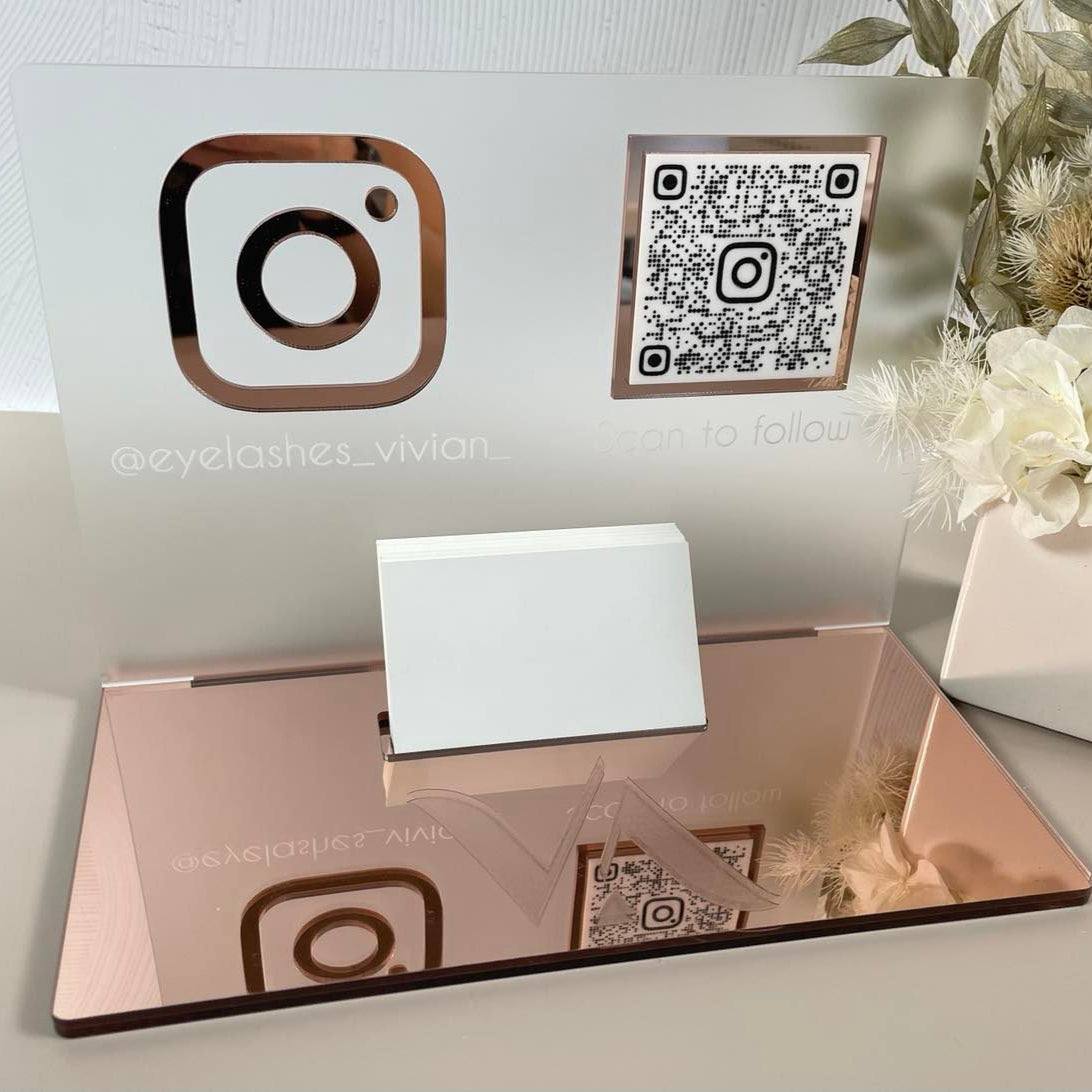 Rose gold acrylic card holder with Instagram icon and social media details