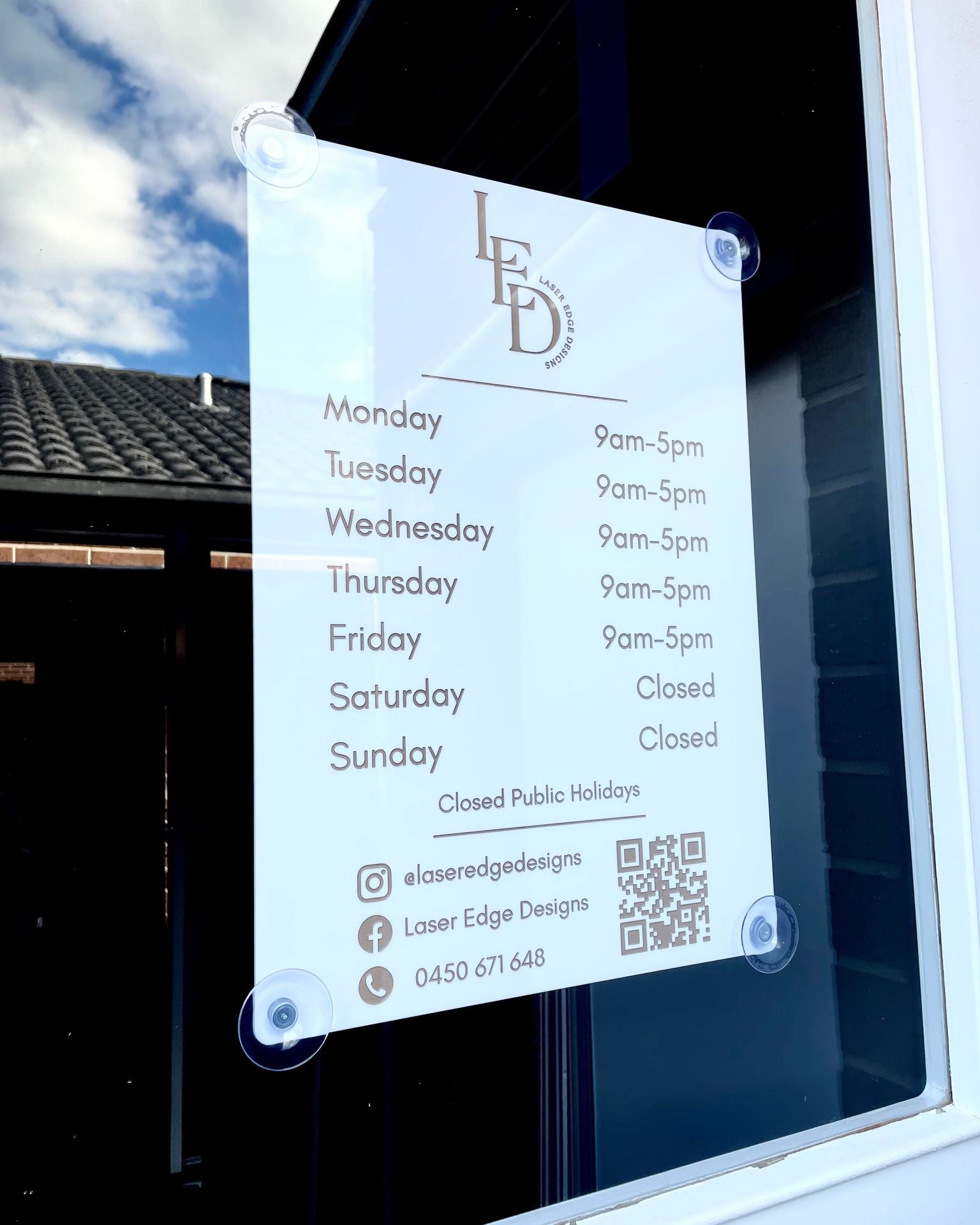 Acrylic opening hours sign with logo, mounted on glass for shopfronts and salons