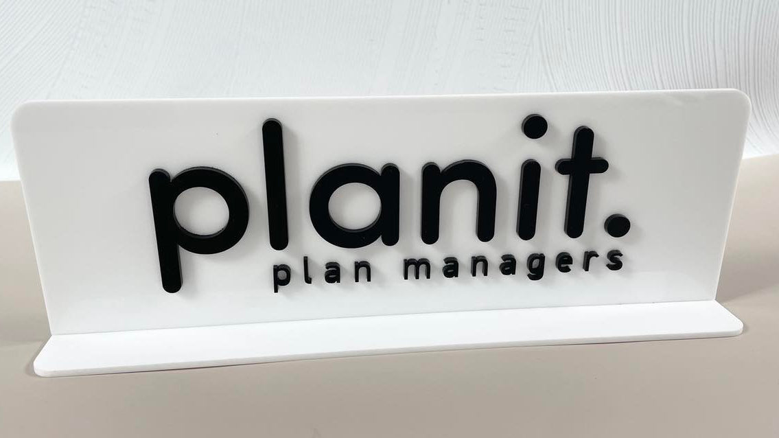 Slim acrylic counter stand with business logo for office or NDIS plan managers