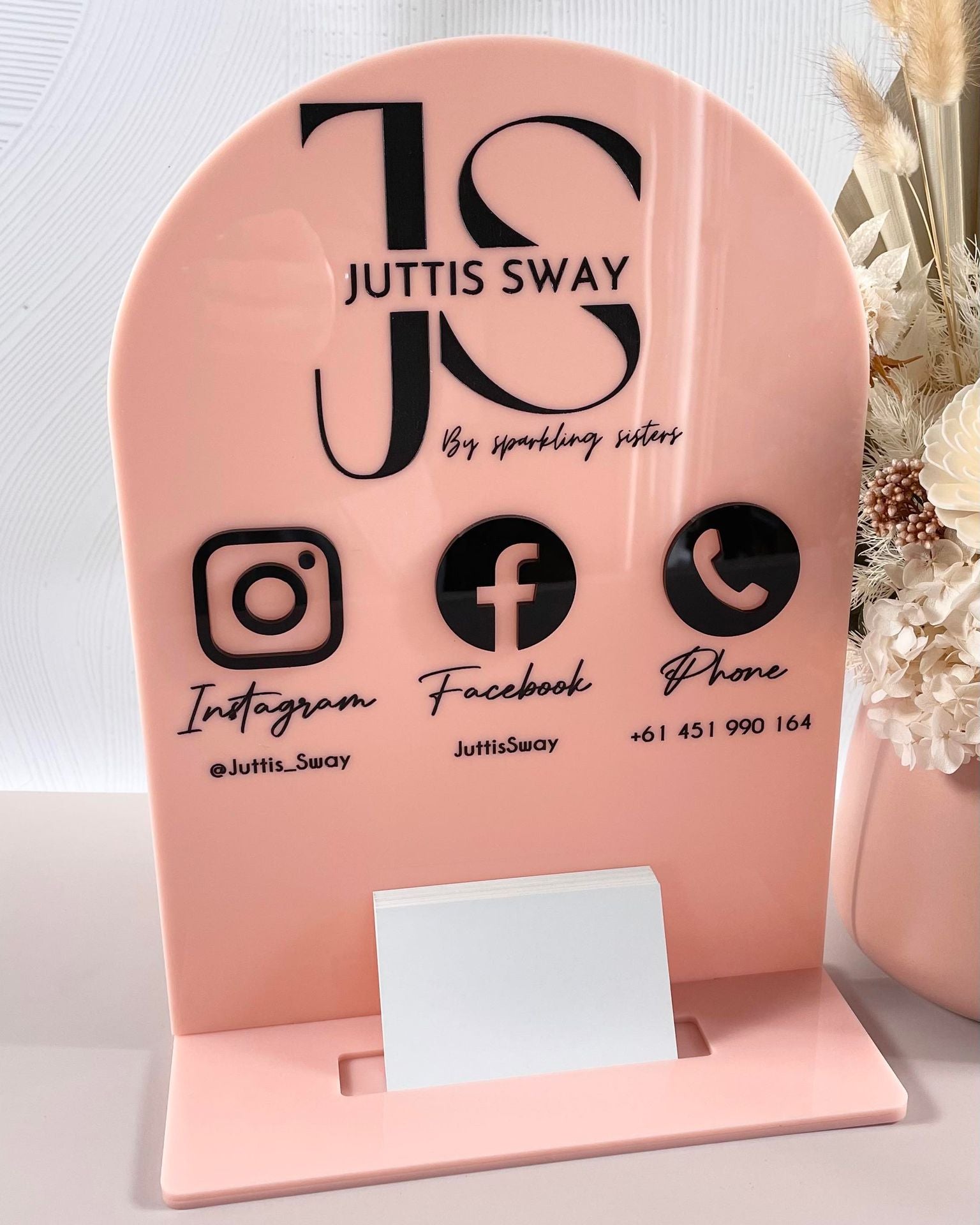 Pink card holder with logo and social icons for Jutes Sway brand