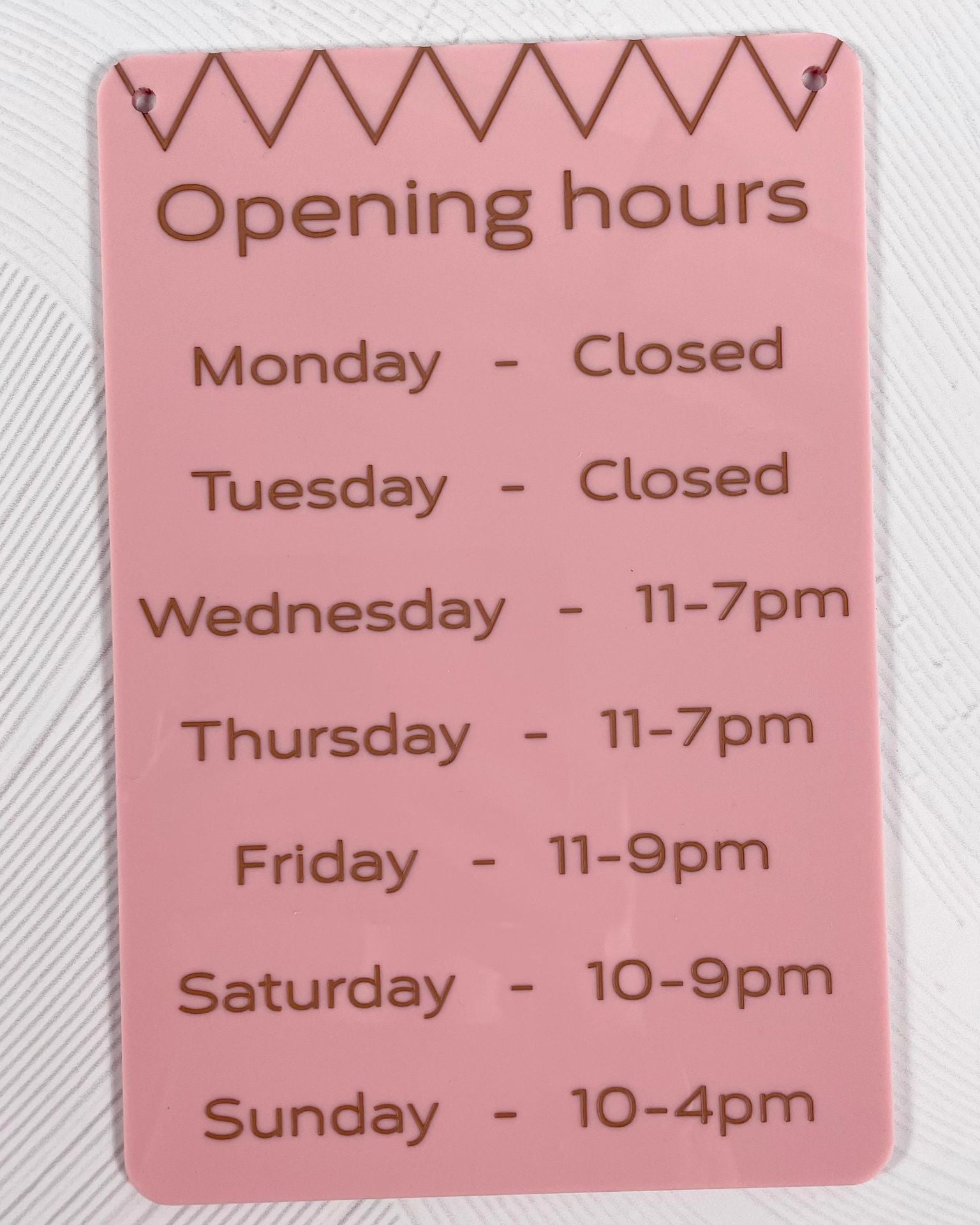 Pink acrylic opening hours sign with custom business hours – modern shop and clinic door signage