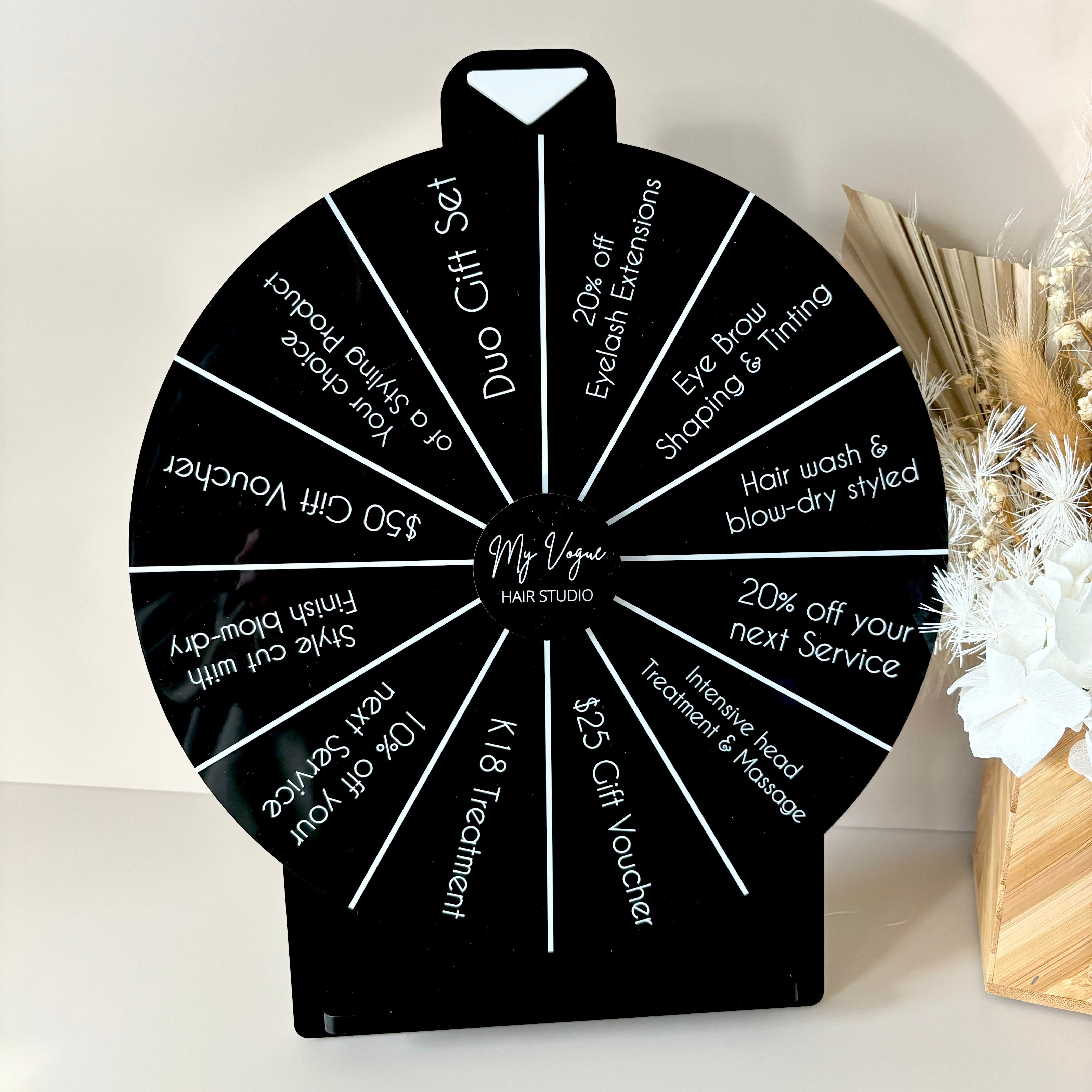 Black spin the wheel with white text for shop giveaways