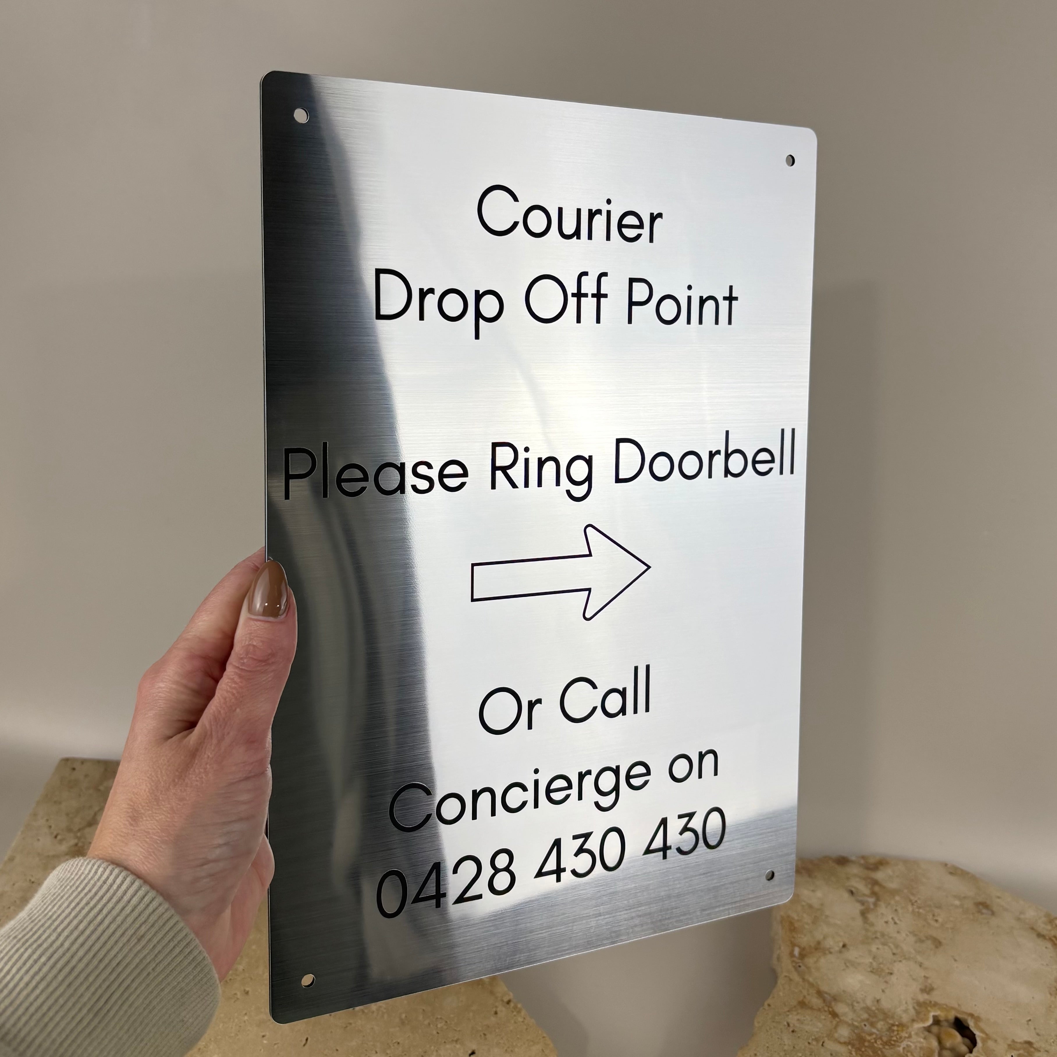 Brushed silver aluminium courier drop off sign with custom business text, modern office and reception signage for parcel deliveries, concierge instructions and commercial entryway signs made in Australia