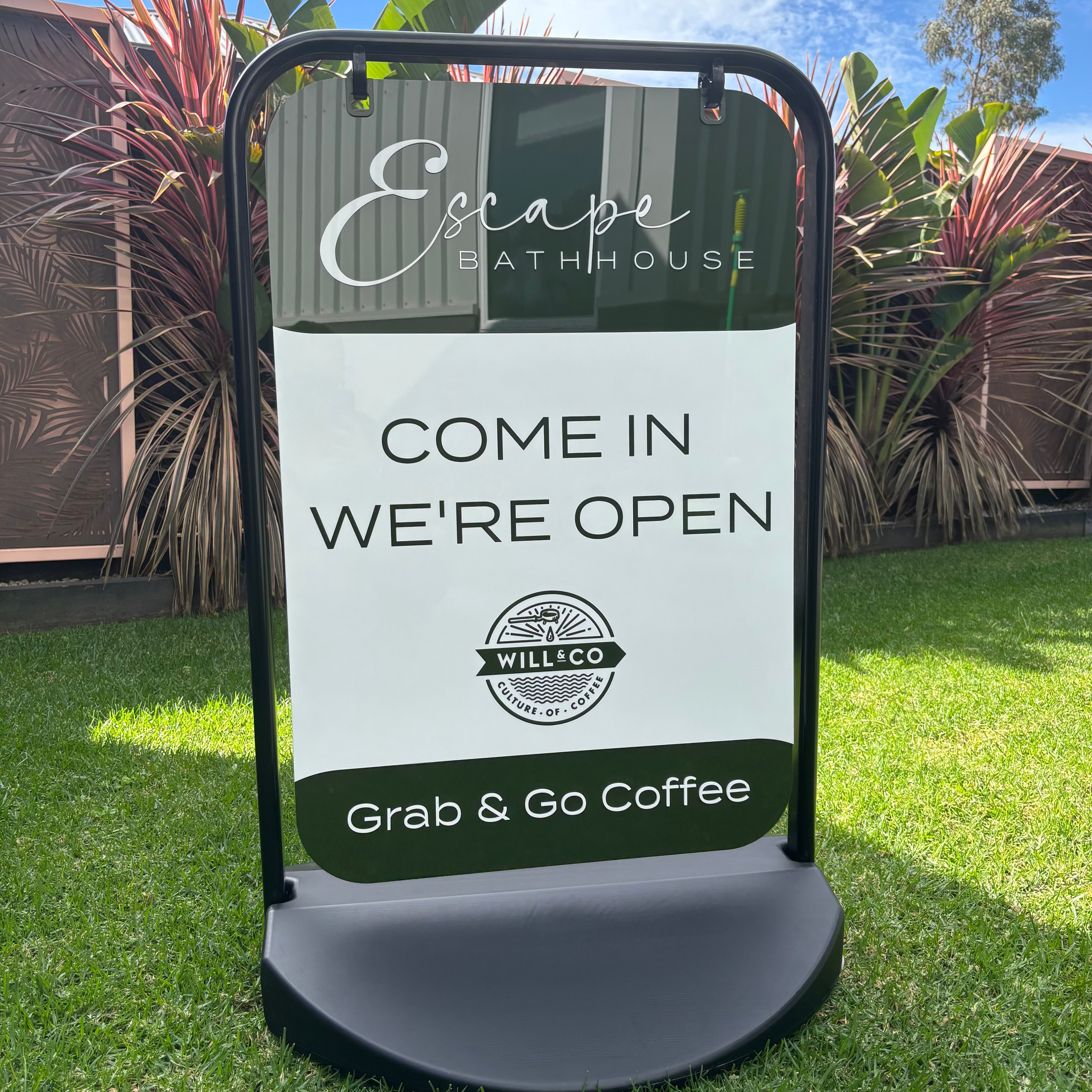 Custom swing sign A-frame with printed business branding, outdoor pavement sign featuring “come in we’re open” message, durable double-sided signage for cafés, salons and retail shops, portable sidewalk advertising sign Australia-made