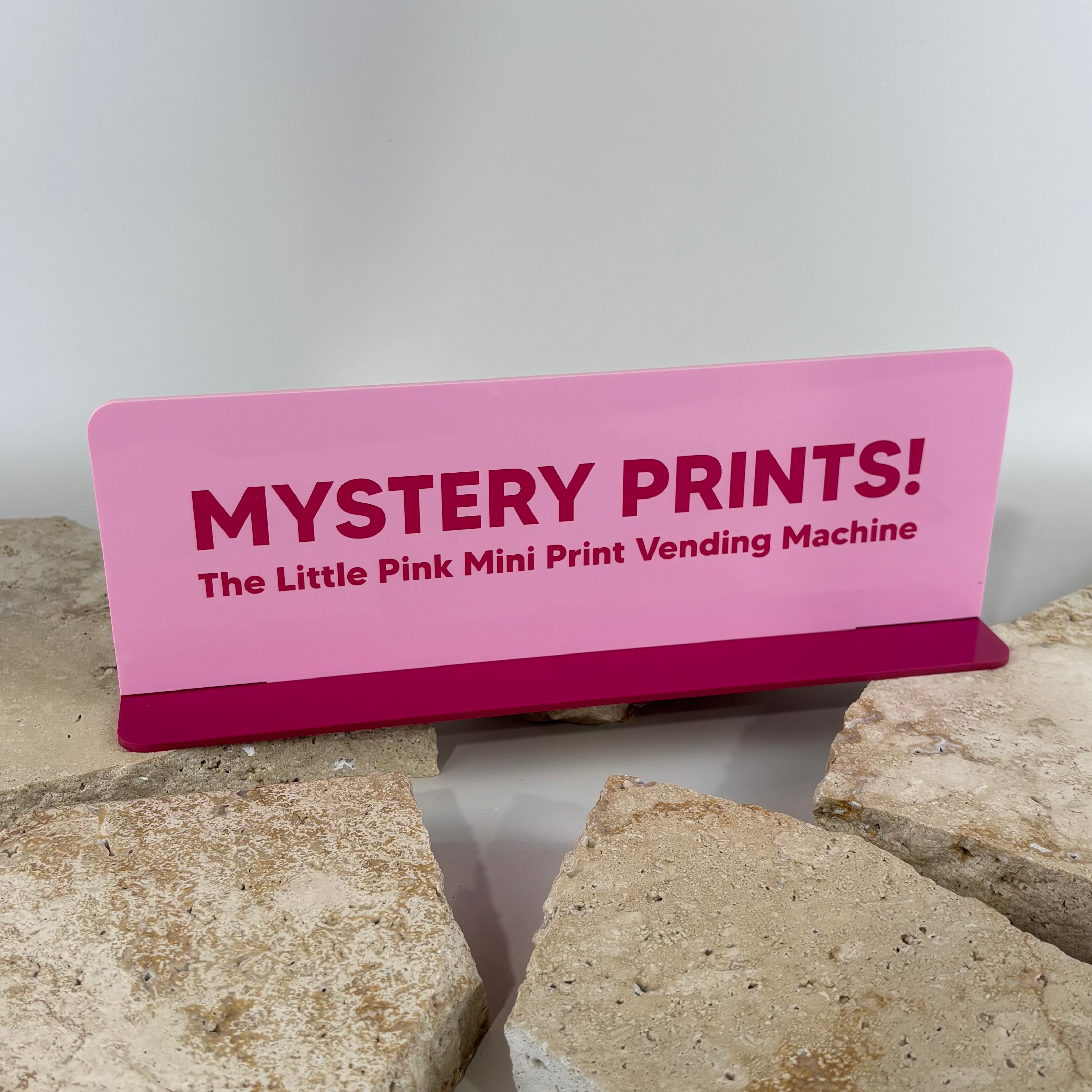 Custom pink acrylic counter sign with UV printed branding, personalised business display sign for retail stores, markets, events and shop counters.