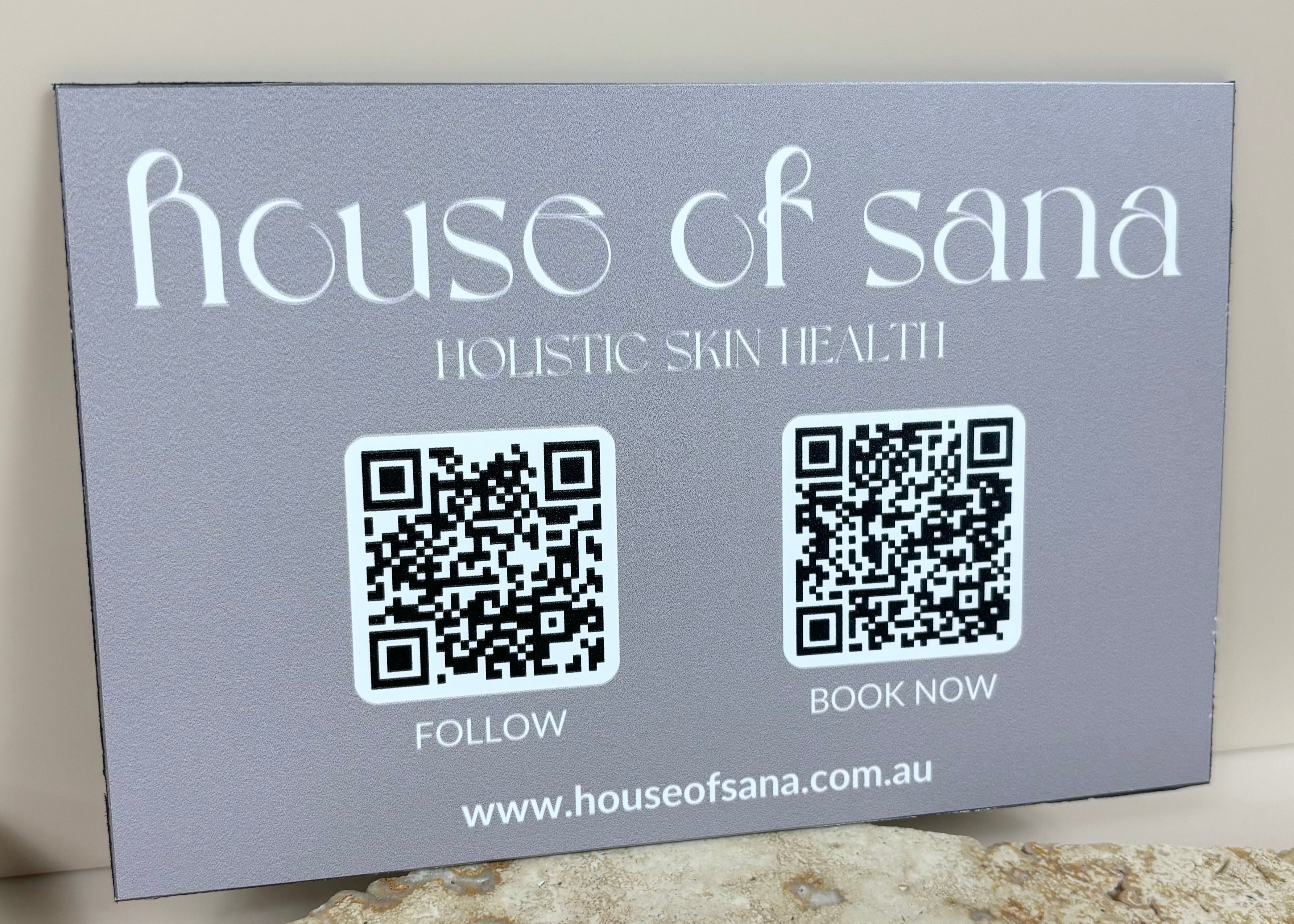 House of Sana QR code aluminium signage, light grey printed sign featuring scannable QR codes for booking and social media.