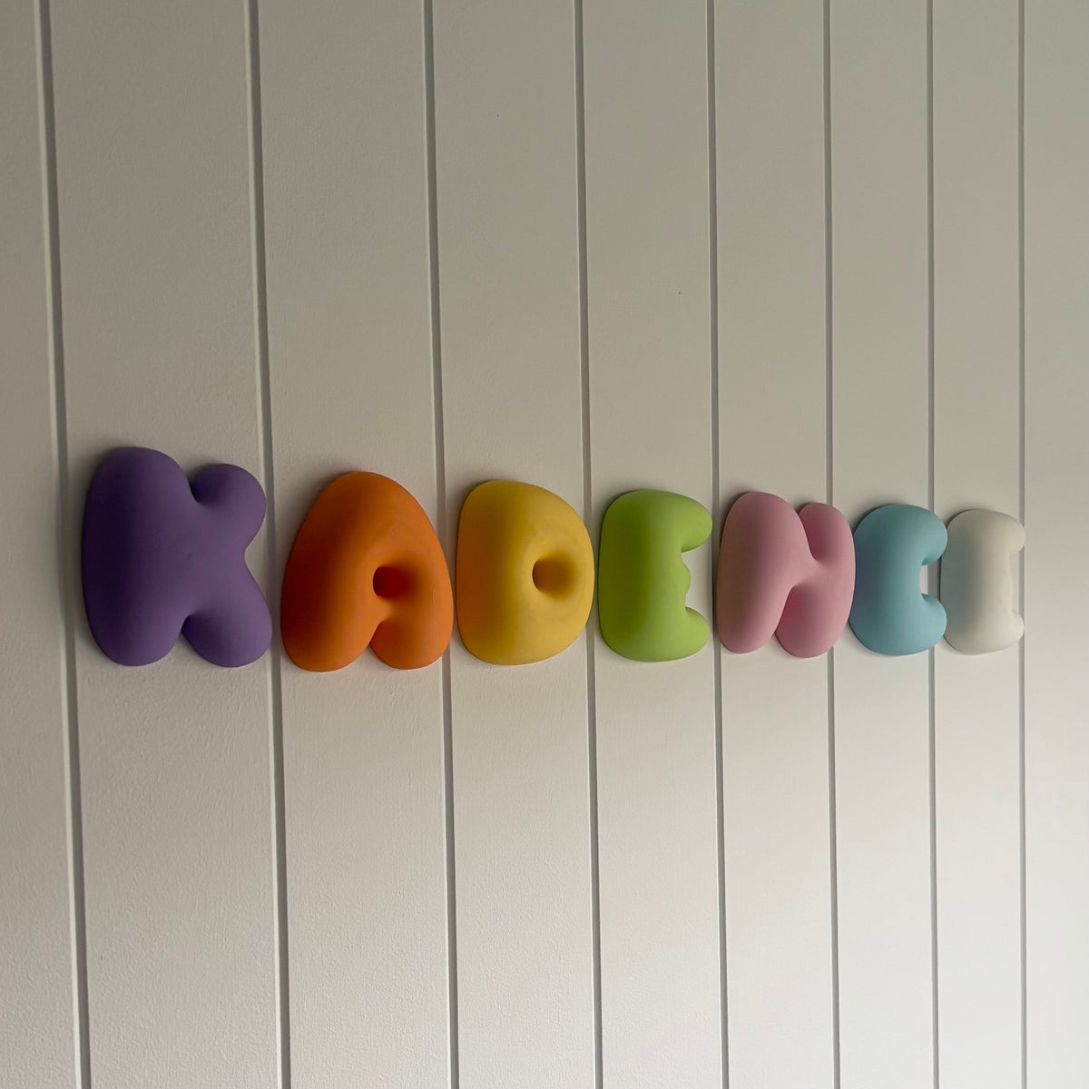 3D printed bubble name wall sign in colourful chunky lettering, personalised for kids’ bedrooms, nurseries and playrooms.