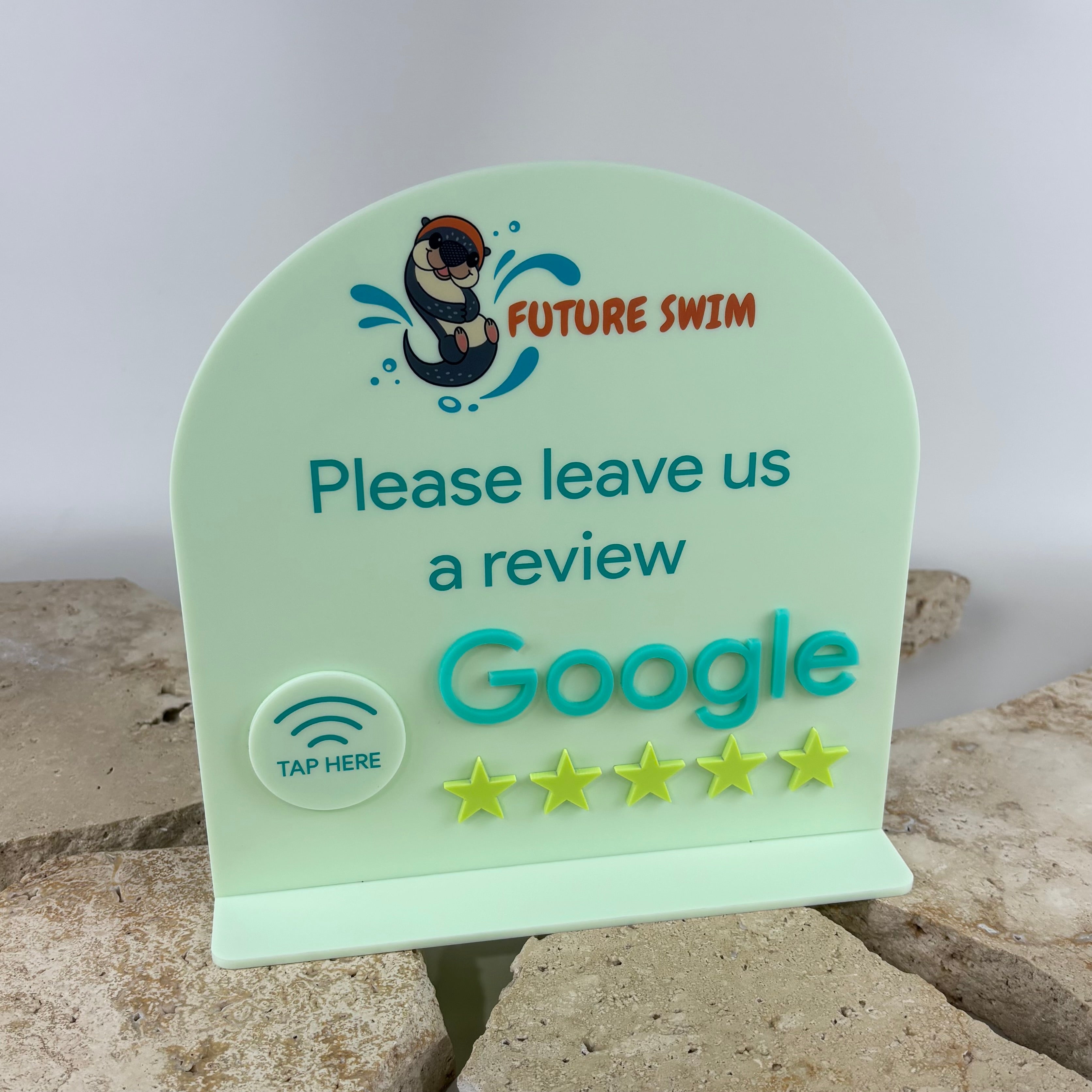 Custom NFC Google review stand for swim schools, aquatic centres and children’s activity businesses. Acrylic review display featuring contactless tap technology, raised 3D Google lettering and star rating elements, encouraging customers to leave Google reviews with a simple tap.