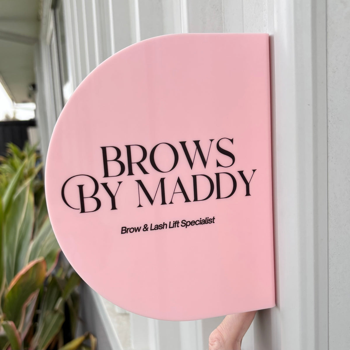 Custom pink acrylic blade sign with business logo, personalised double sided wall mounted salon sign for brow, lash, beauty and cosmetic businesses.
