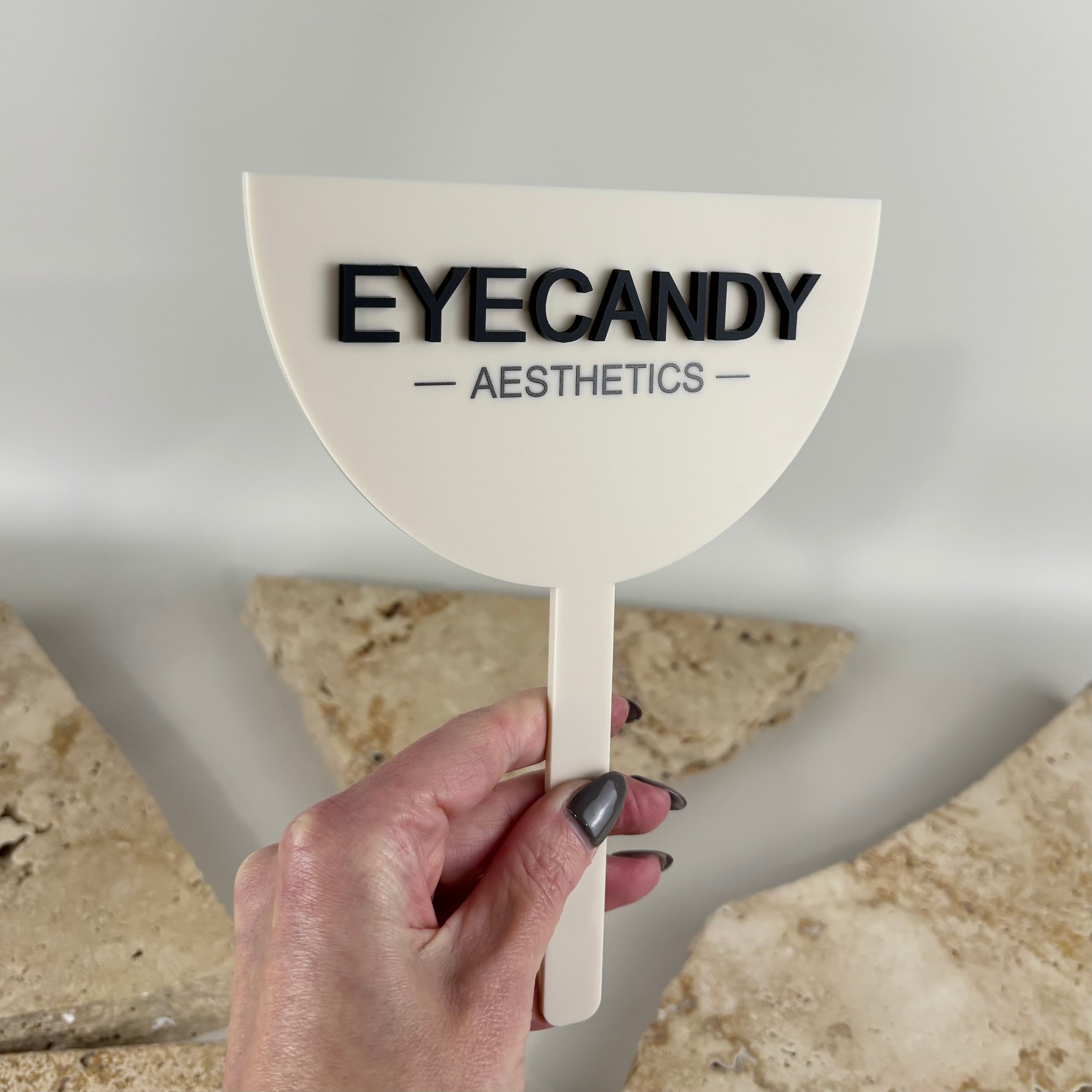 Personalised acrylic handheld beauty salon mirror with raised 3D business logo, custom branding mirror for aesthetic clinics, beauty salons, lash technicians, brow artists, makeup artists and skincare professionals.