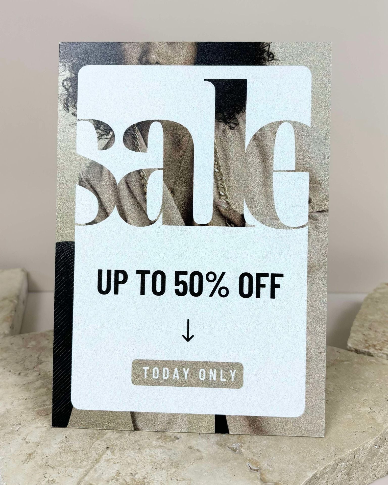 Retail countertop signage showing custom acrylic sale display