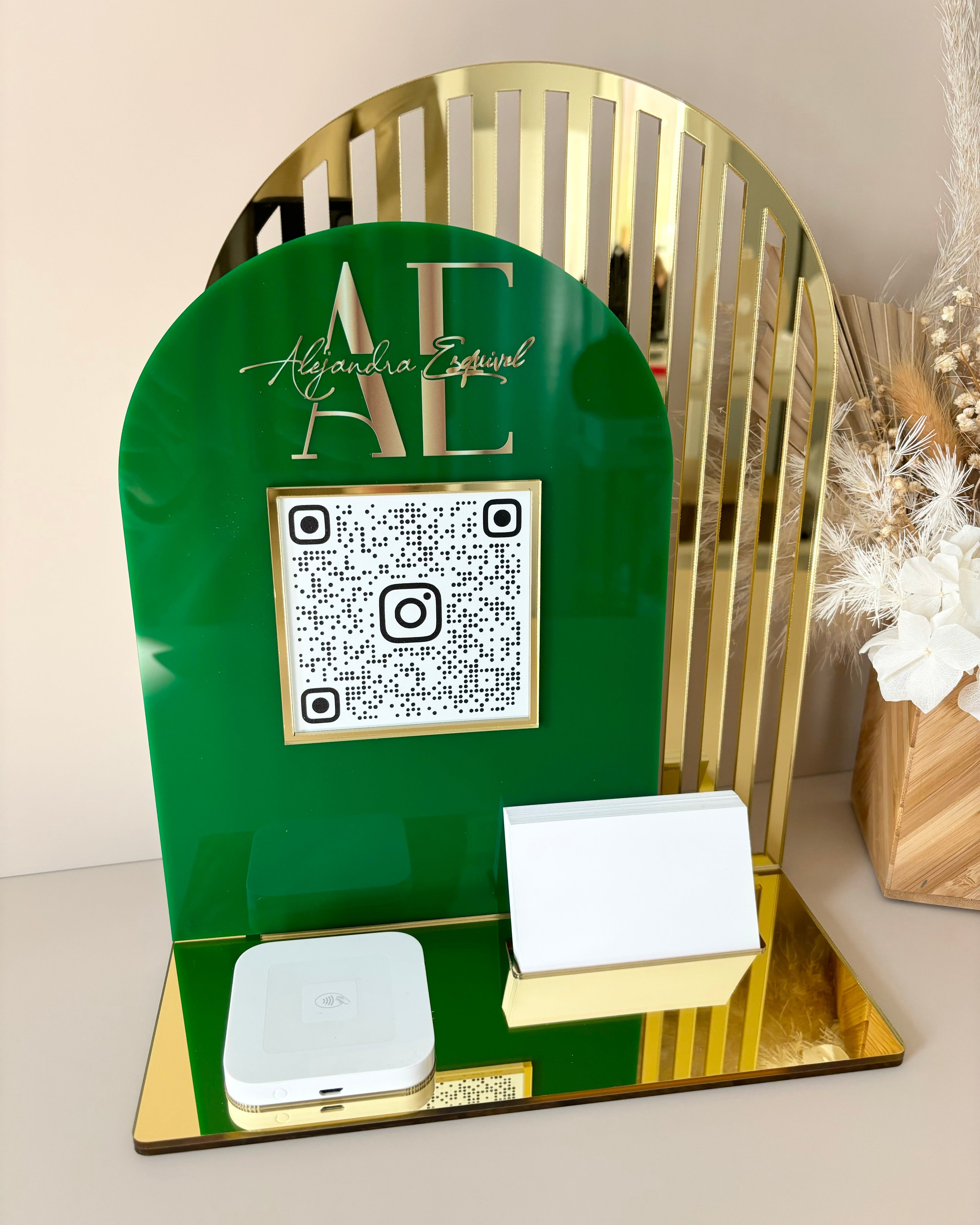 Green and gold acrylic stand with massage business QR code and Square reader holder