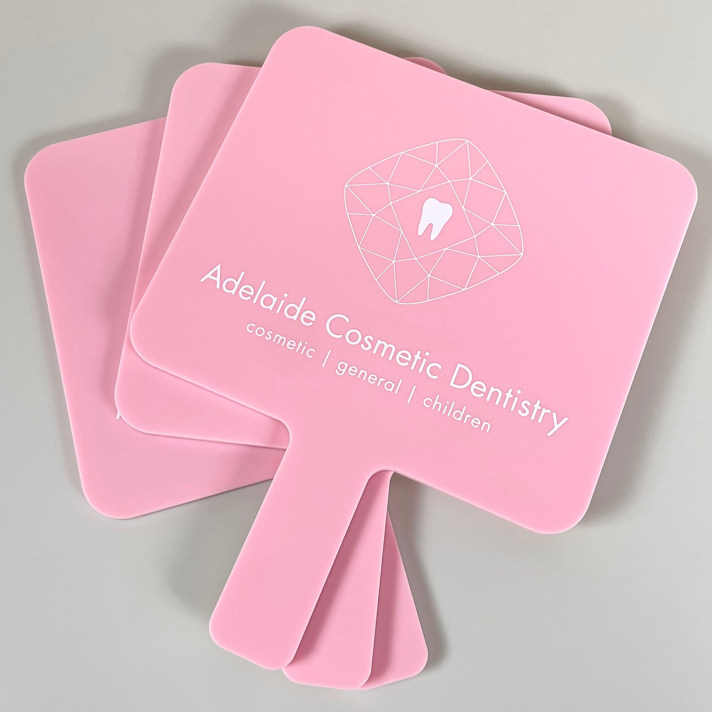 Set of branded mirrors with Modern Cosmetic Dentistry logo
