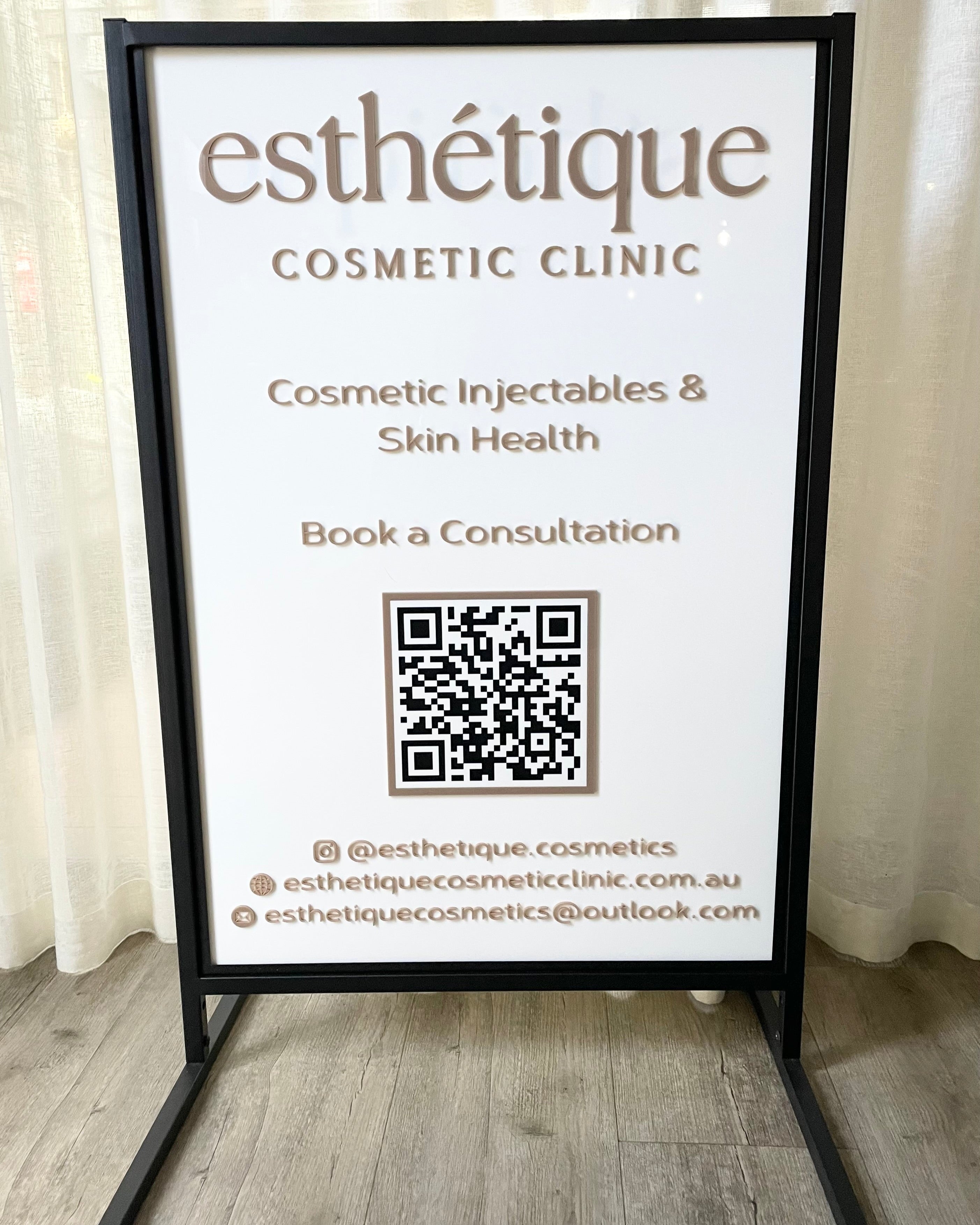 White outdoor T frame advertising stand for clinic bookings