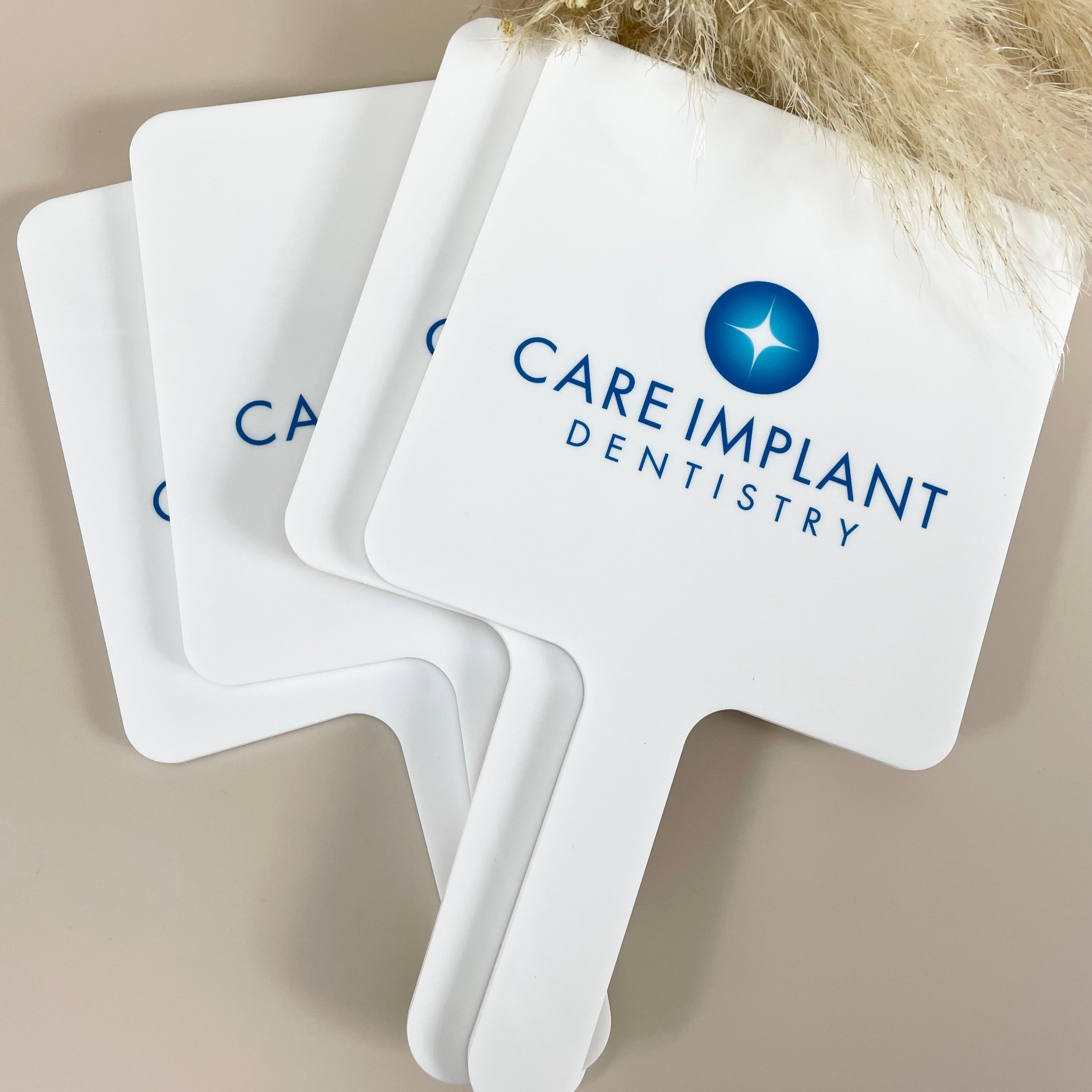 Set of Care Implant Dentistry branded handheld mirrors