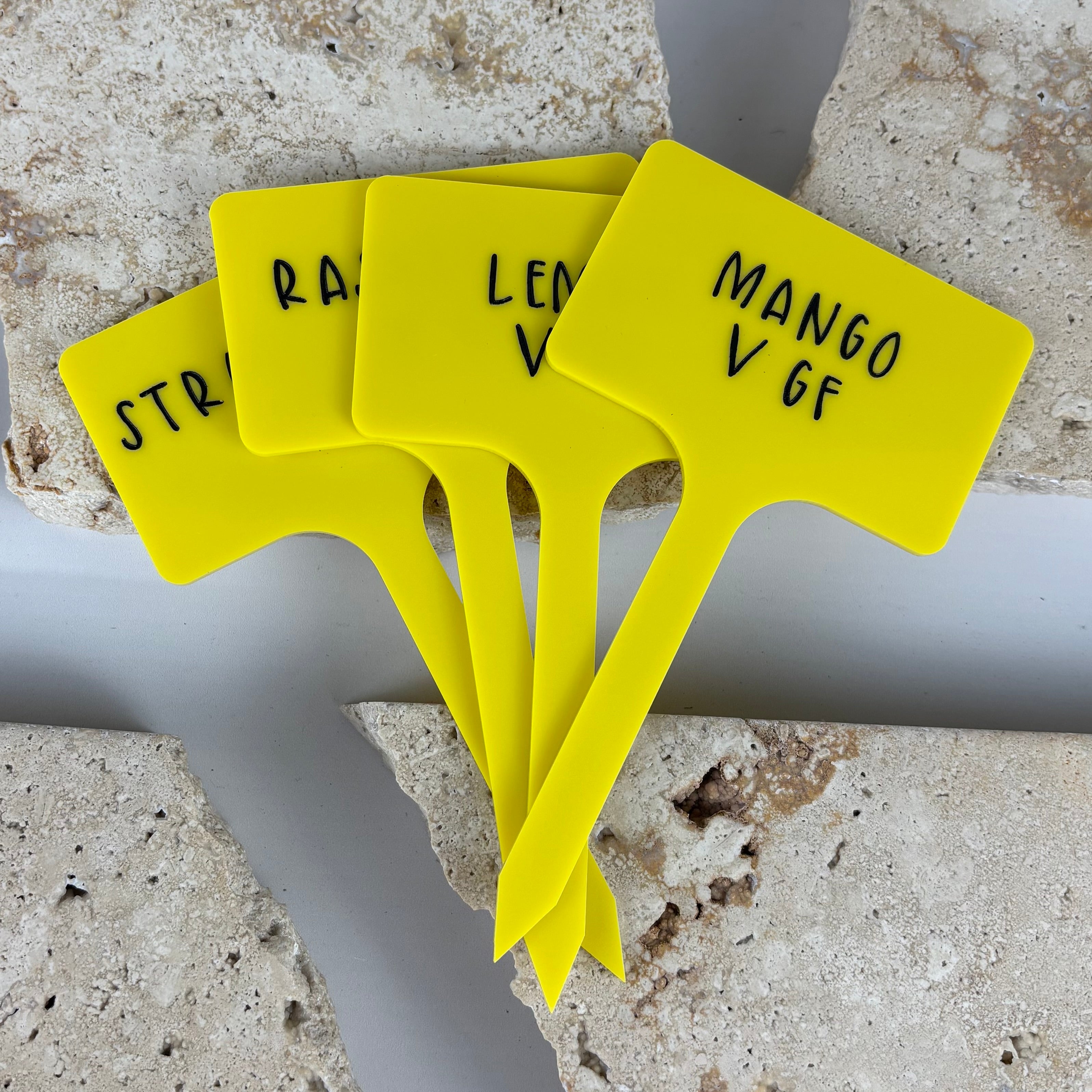 Custom acrylic ice cream sticks with raised black lettering, reusable flavour markers for ice cream tubs, cafés, dessert bars and events, bright yellow personalised ice cream labels Australia