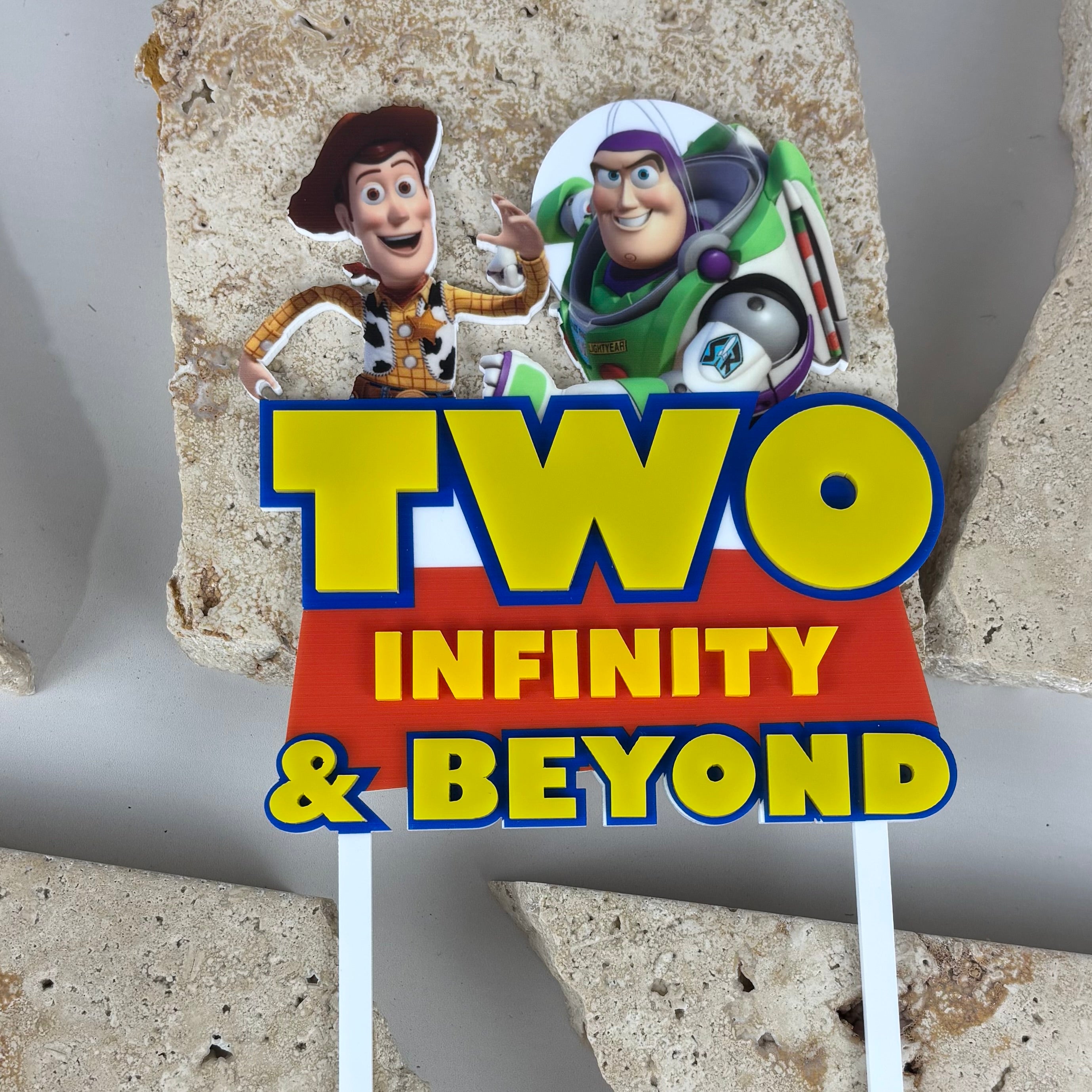 Custom Toy Story cake topper featuring Woody and Buzz Lightyear with Two Infinity and Beyond wording for kids birthday cake