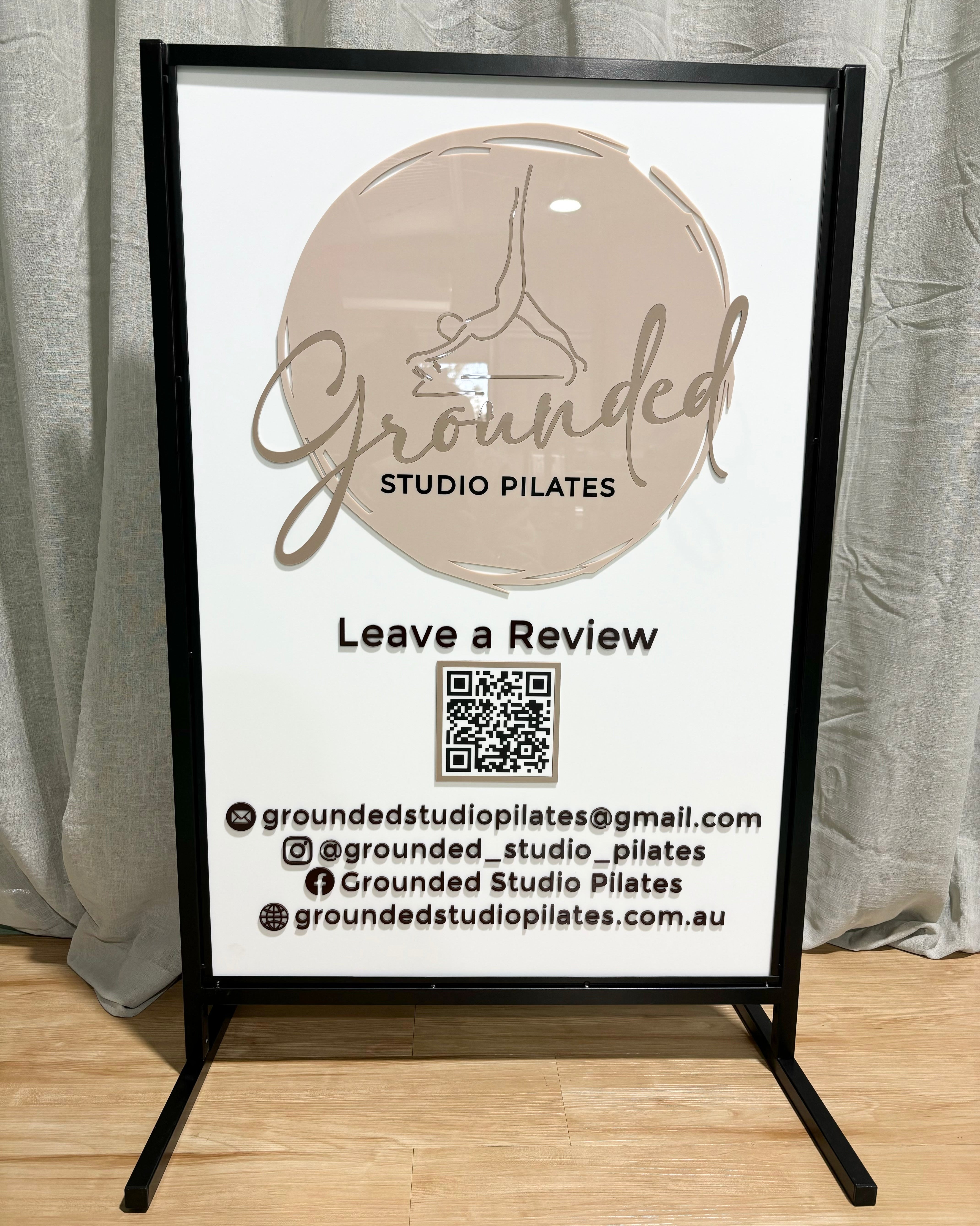 White outdoor T frame sign encouraging customer reviews