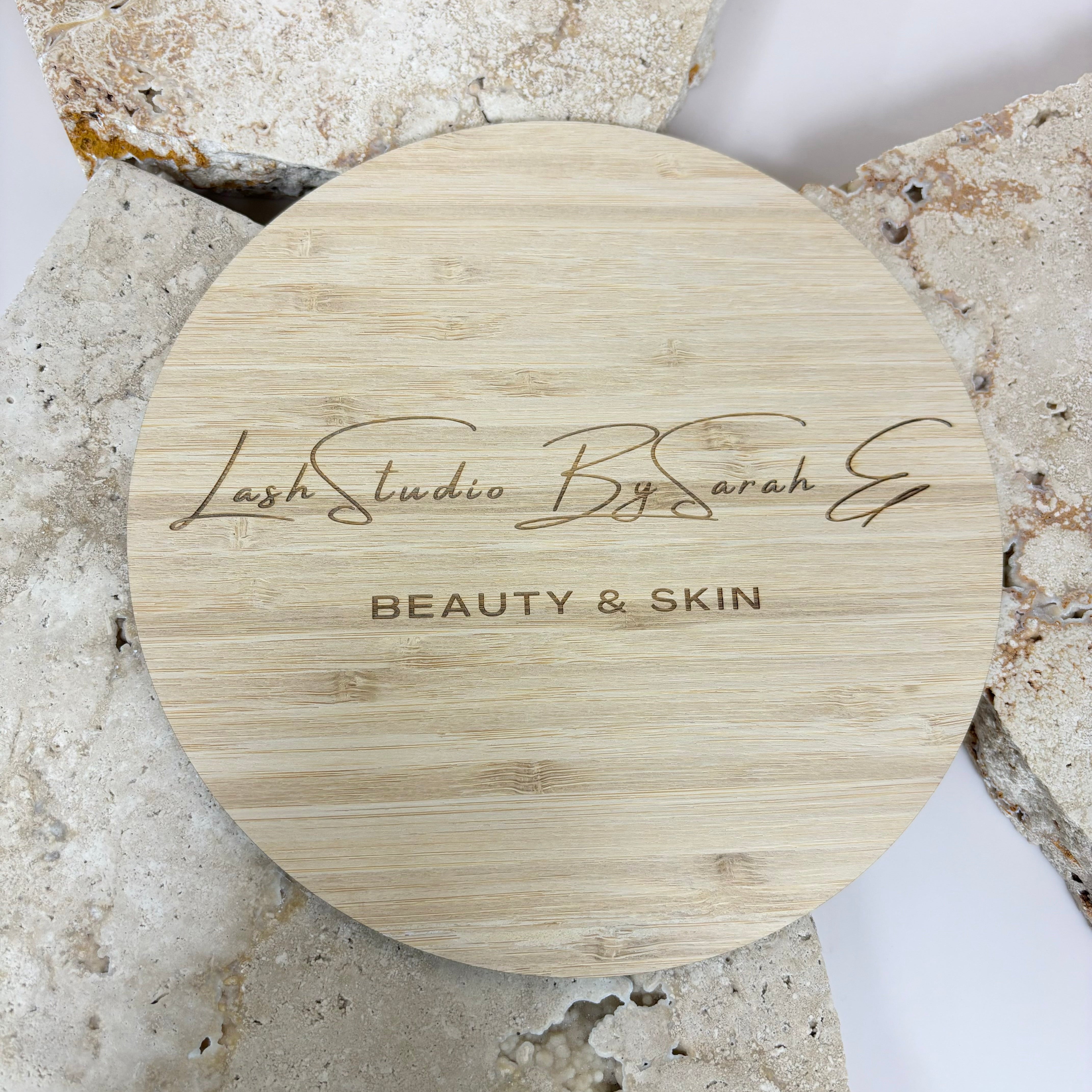 Laser engraved bamboo logo disc for business branding in photos and social media