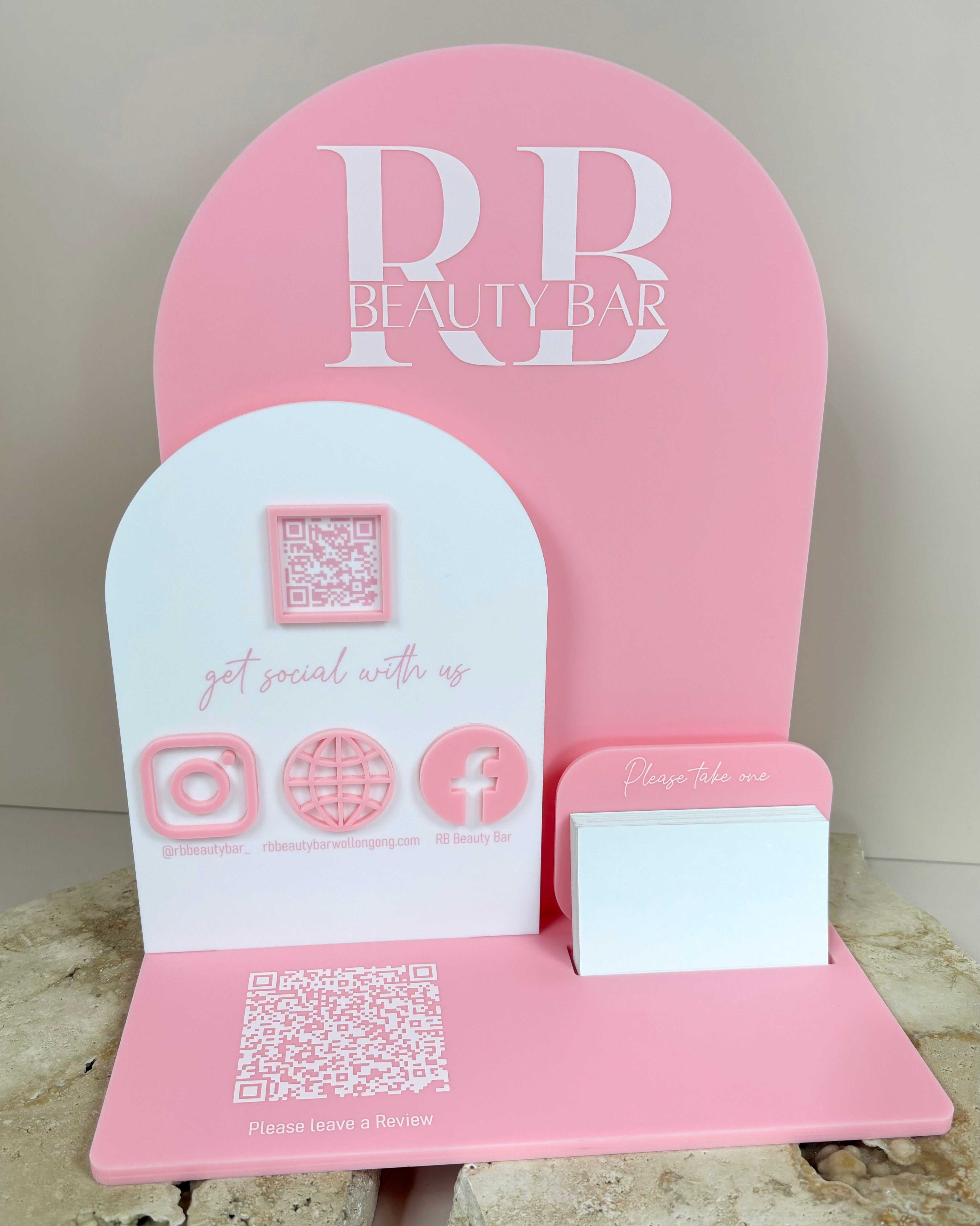Pink double arched acrylic stand with custom logo and social media display