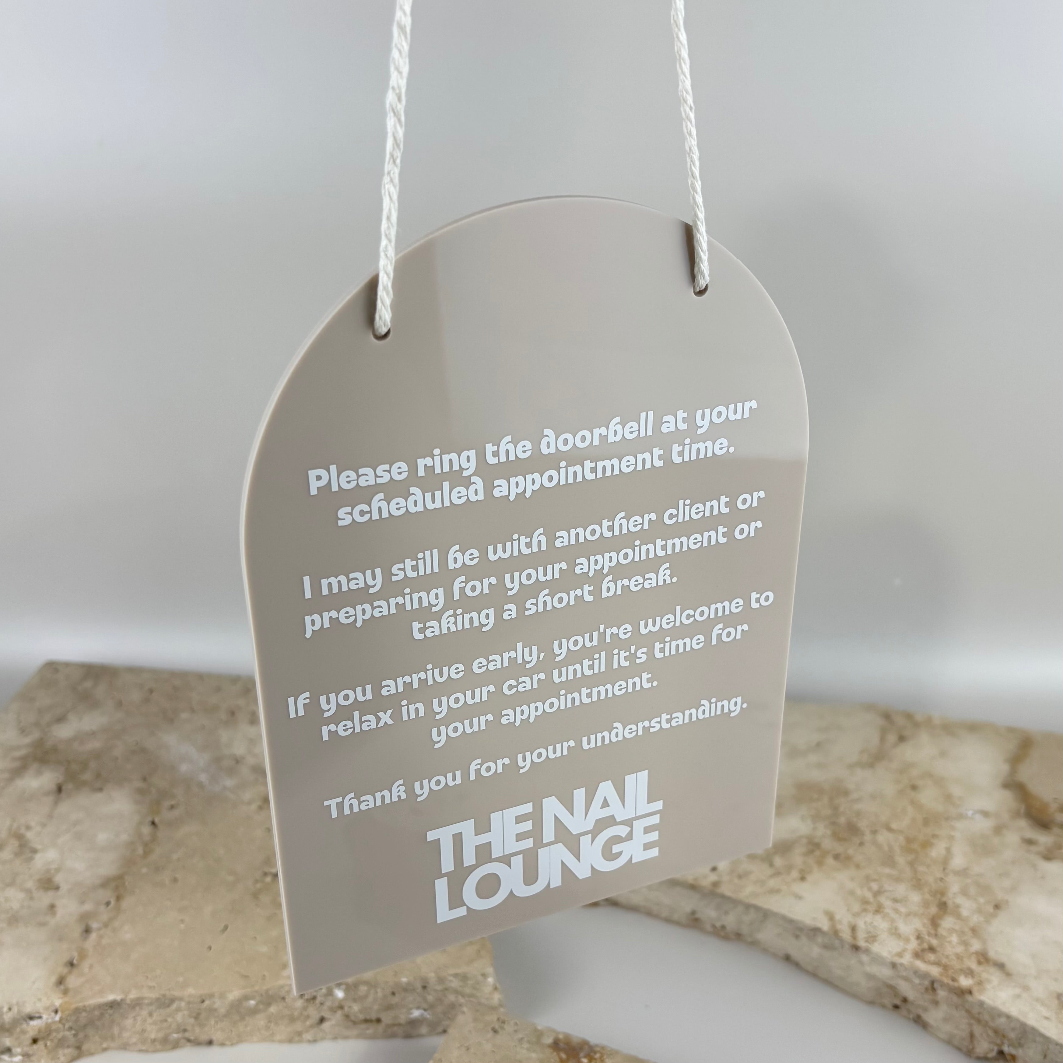 Custom hanging acrylic appointment sign with personalised business logo and client instructions, ideal door signage for salons, beauty studios and appointment-based businesses.