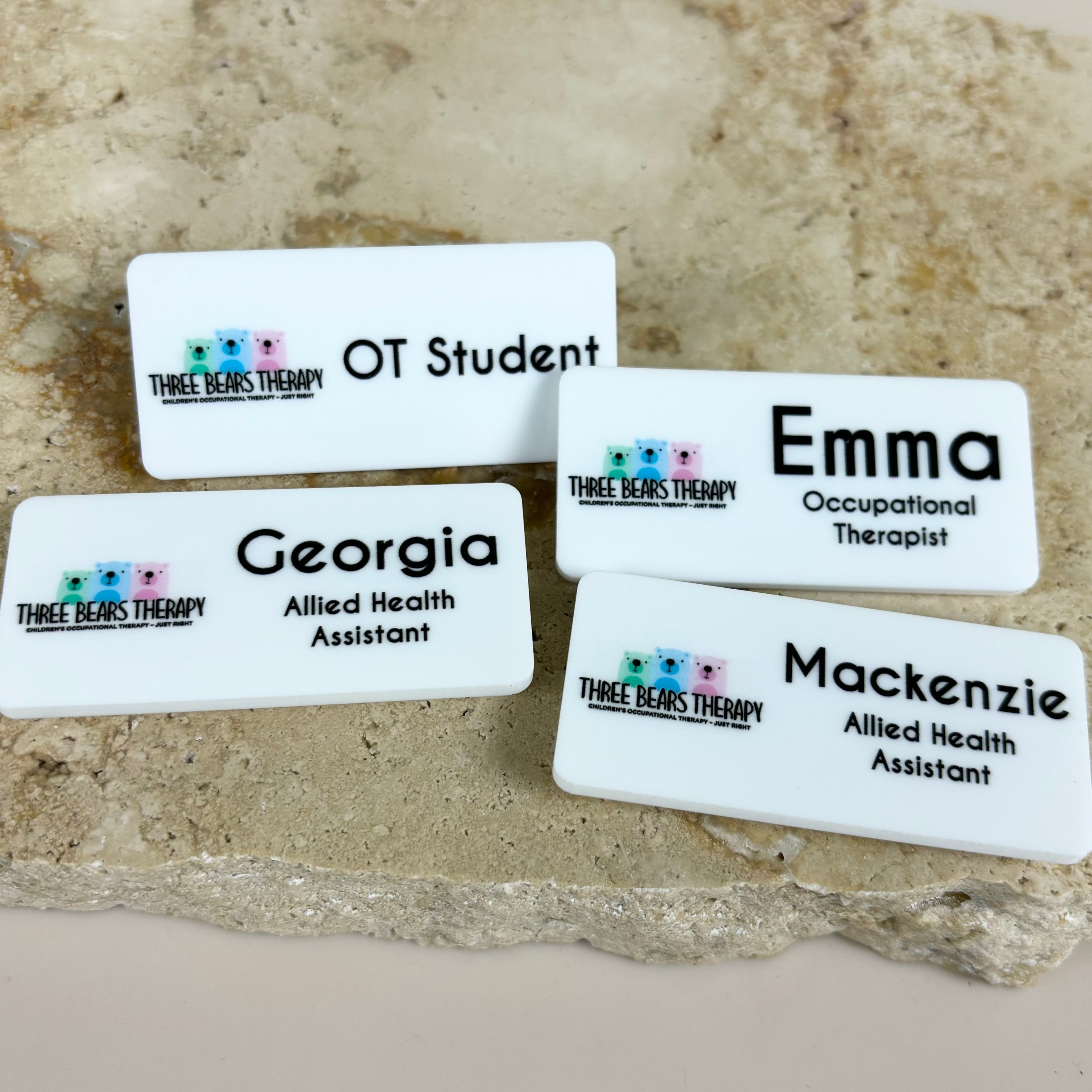 Multiple custom logo name badges displayed together