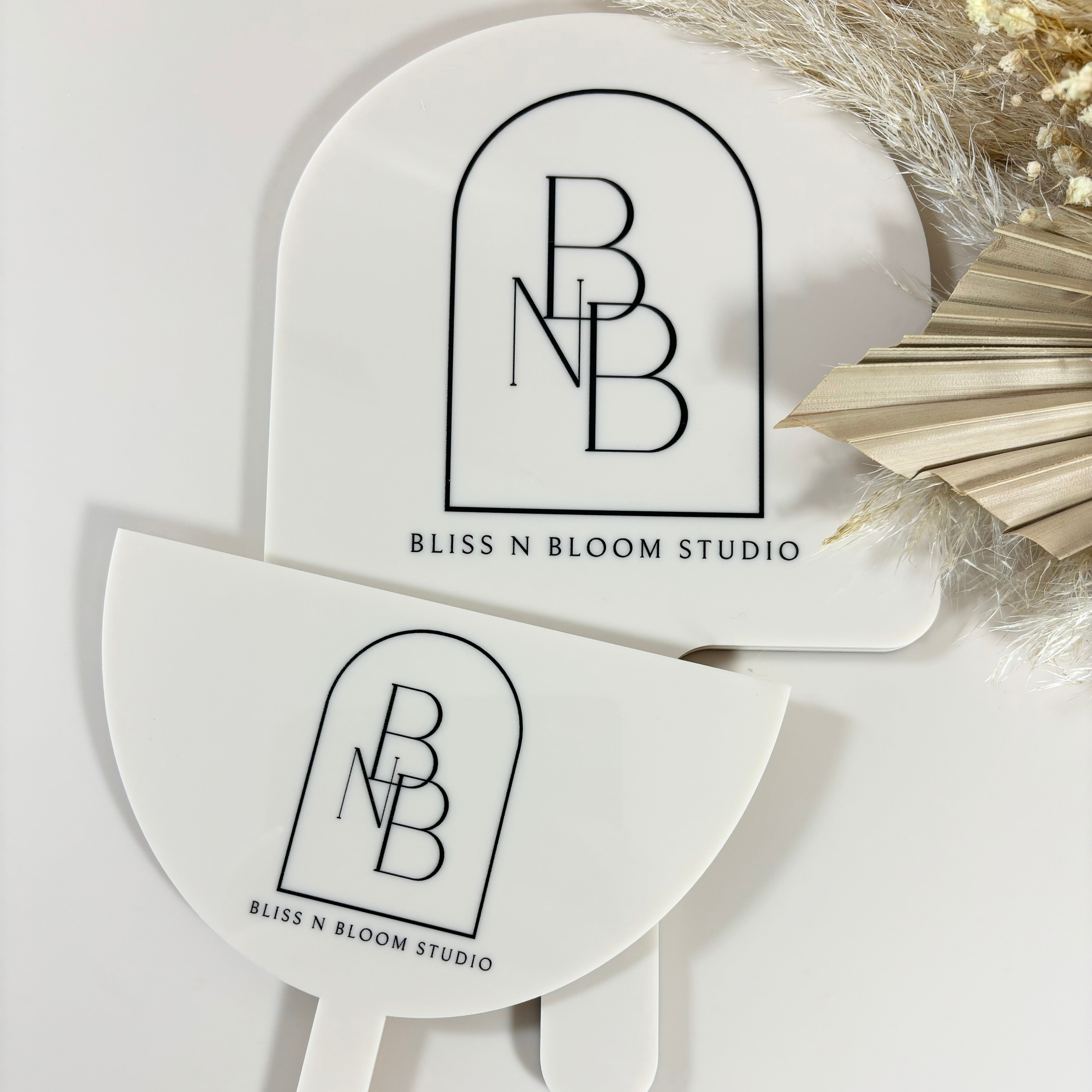 Beige handheld mirror and face shield set with Bliss N Bloom Studio logo, personalised acrylic salon accessories for beauty professionals