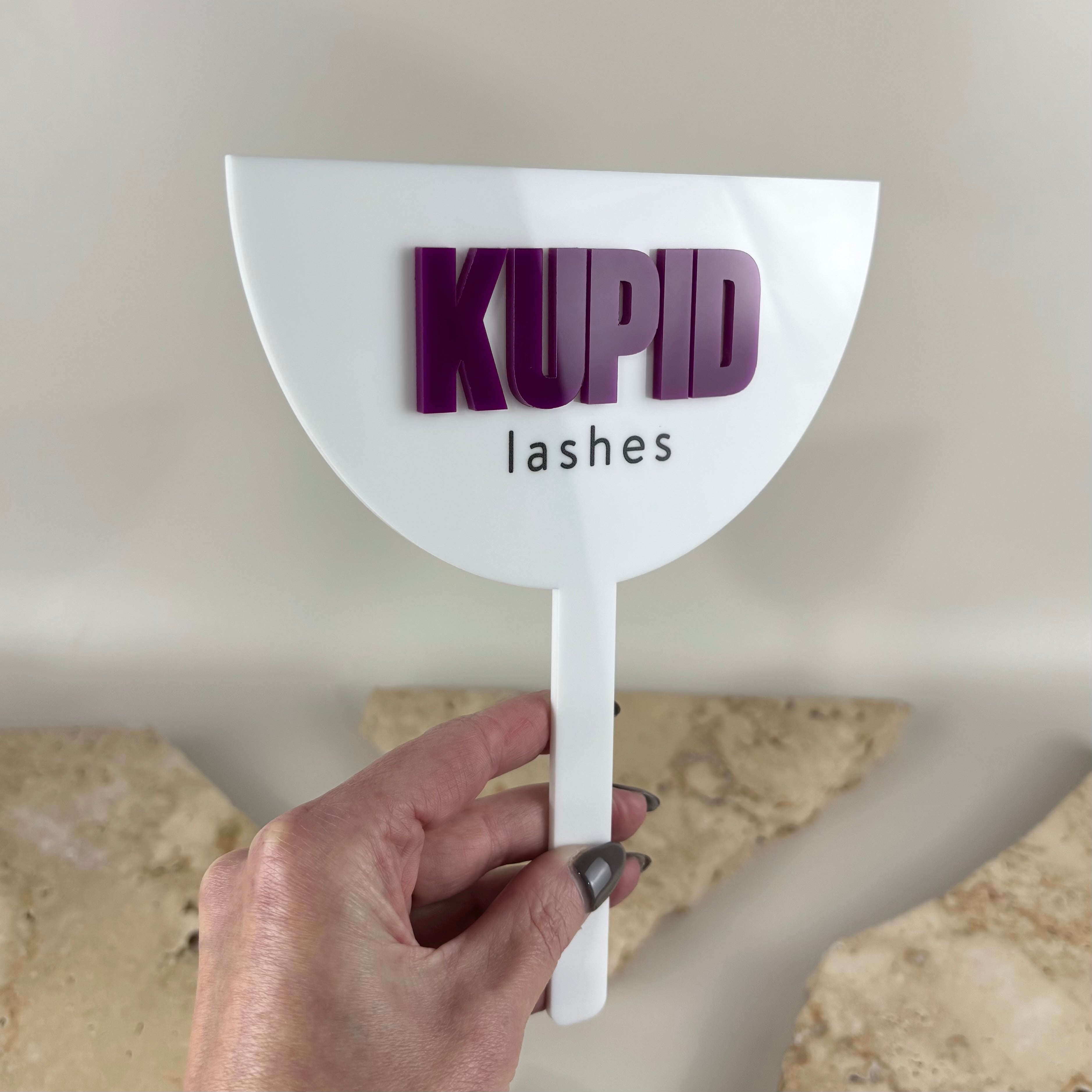 Custom acrylic handheld salon mirror with 3D business logo, personalised beauty mirror for lash artists, eyelash extensions, beauty salons, makeup artists, brow studios and cosmetic clinics.