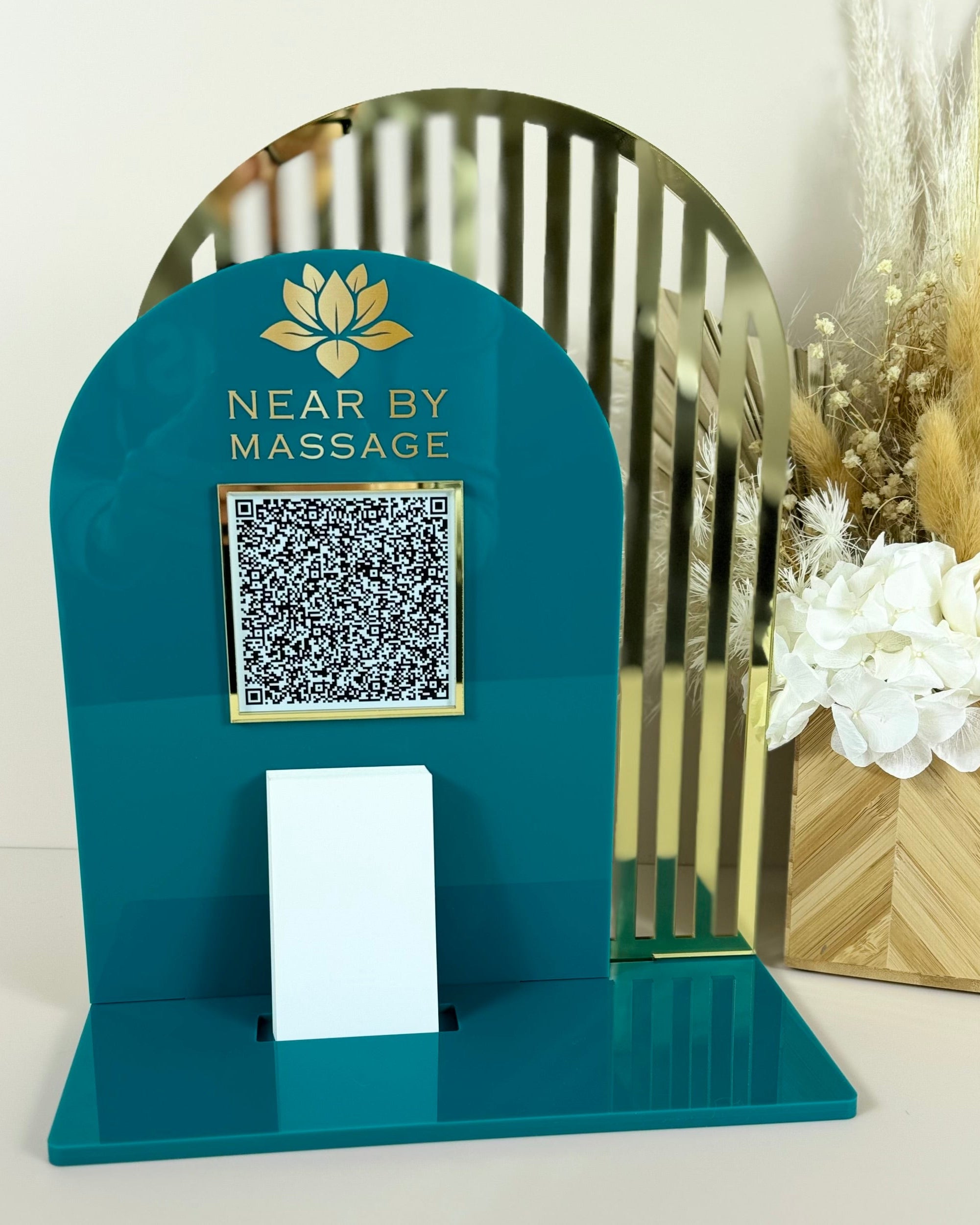 Green and gold acrylic stand with massage business QR code and card holder